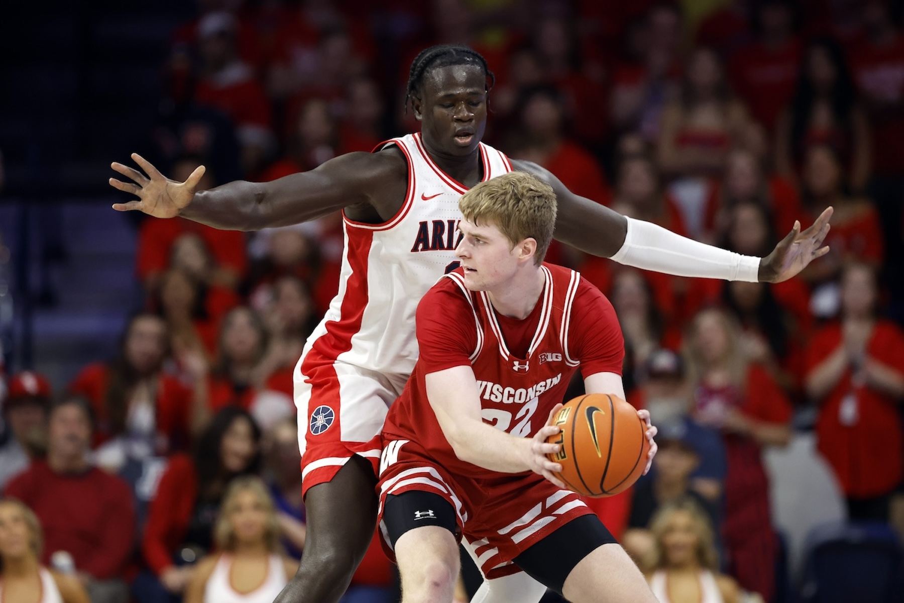 Oumar Ballo defends against Steven Crowl of the Wisconsin Badgers