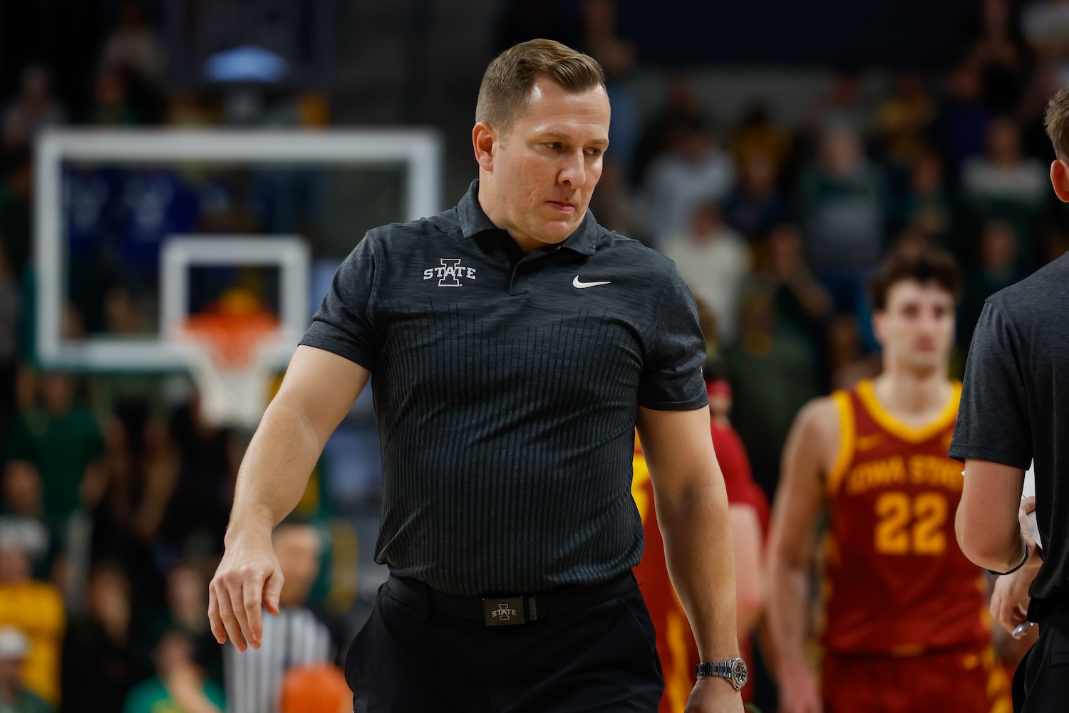Iowa State head coach TJ Otzelberger walks onto the court during a timeout