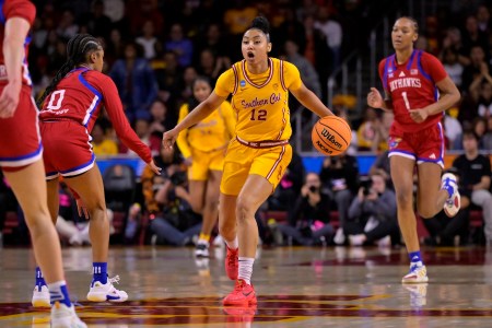 JuJu Watkins, sophomore guard at USC, the University of Southern California, dribbles up the basketball court.