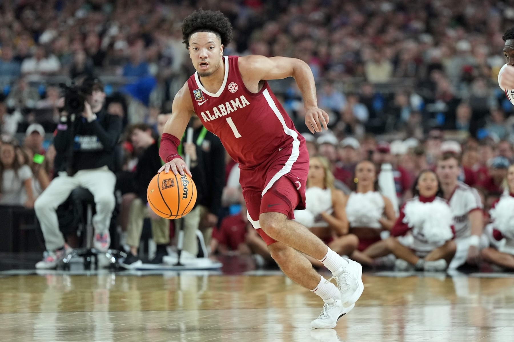 Mark Sears #1 of the Alabama Crimson Tide dribbles up court