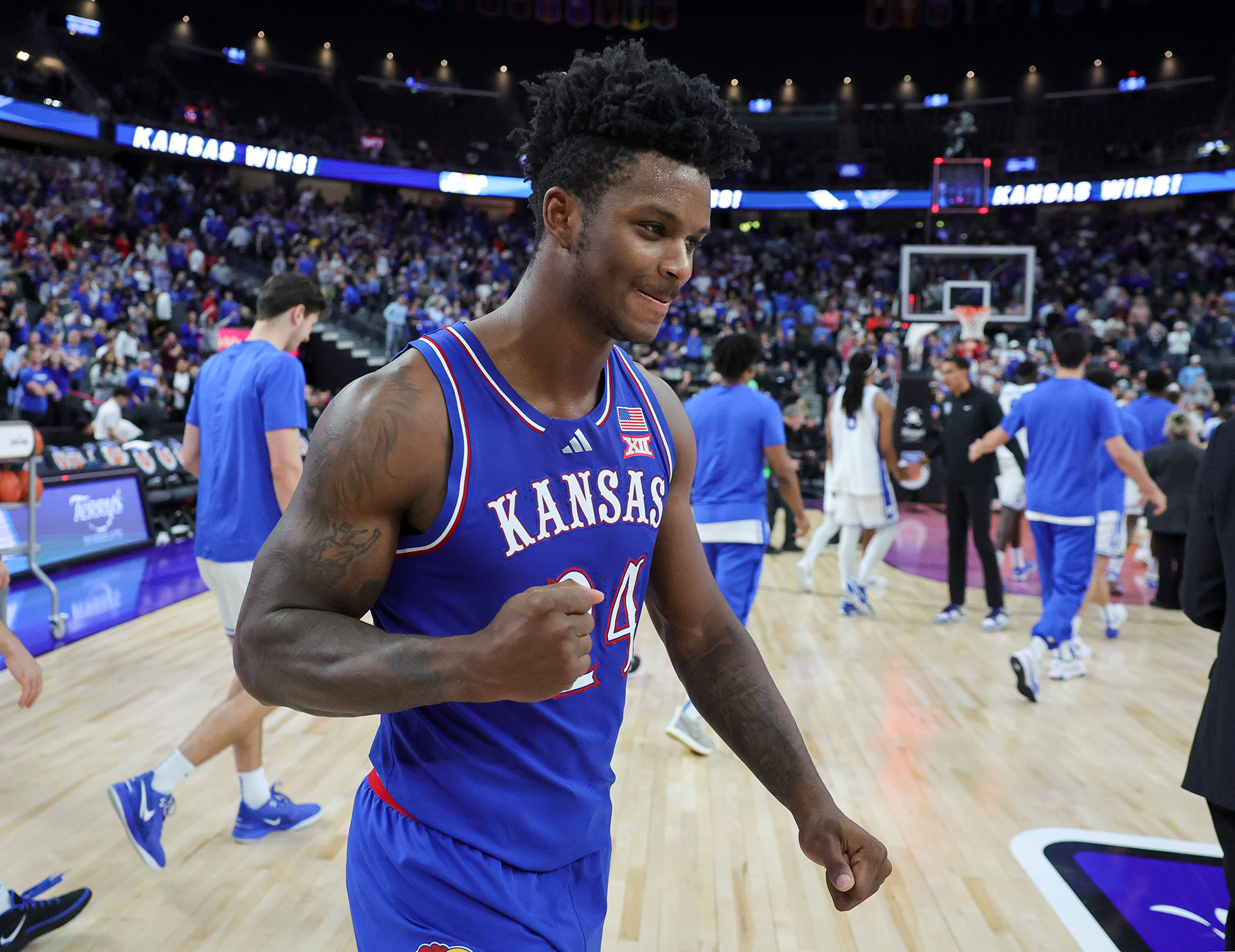 Kansas forward KJ Adams Jr. pumps his fist to celebrate a win over Duke.
