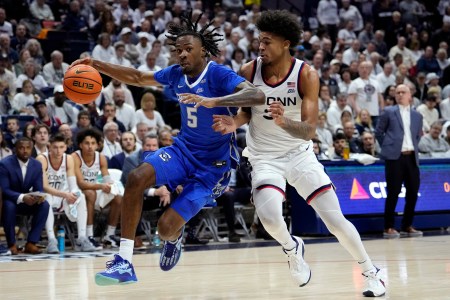 Jamiya Neal of the Creighton men's basketball team drives the basketball against UConn