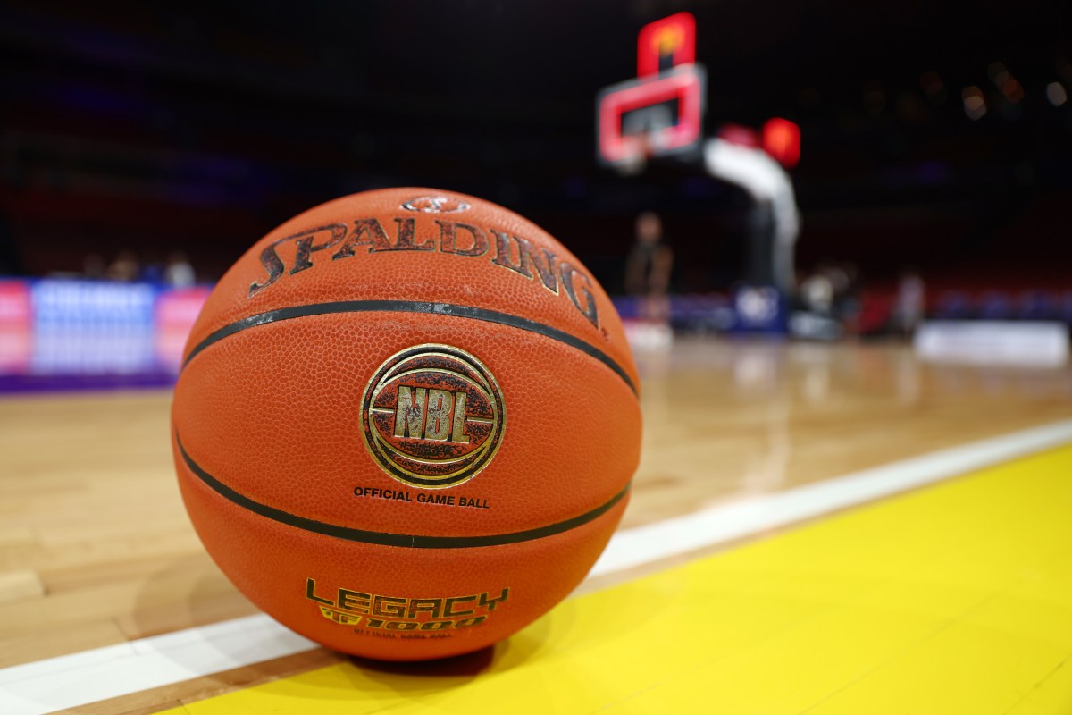 A basketball sits on a court