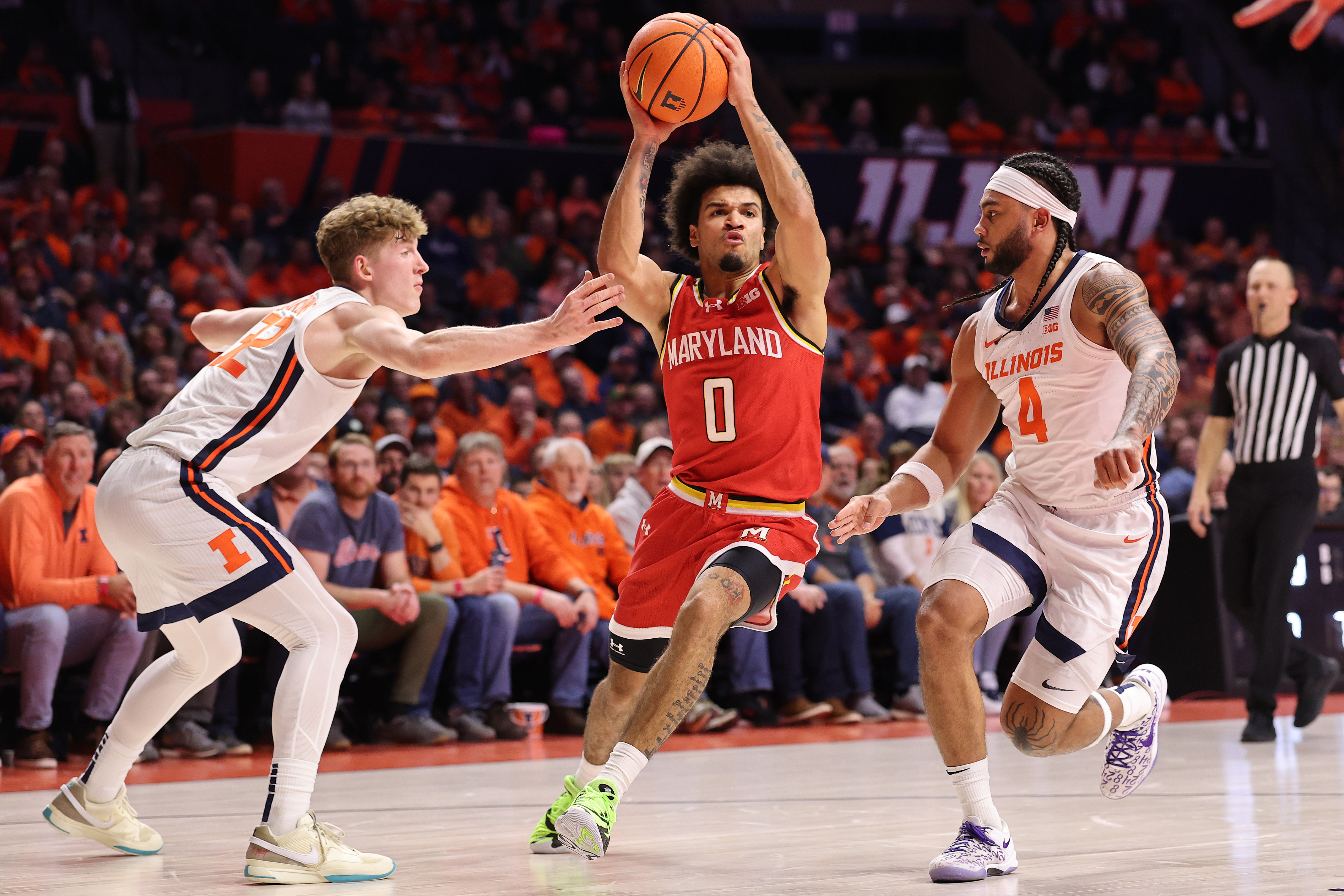 Maryland men's basketball player Ja'Kobi Gillespie drives to the basket against Illinois