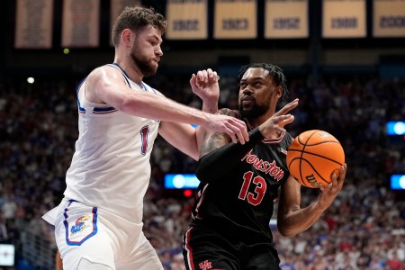 J'Wan Roberts of Houston men's basketball posts up against Hunter Dickinson of Kansas