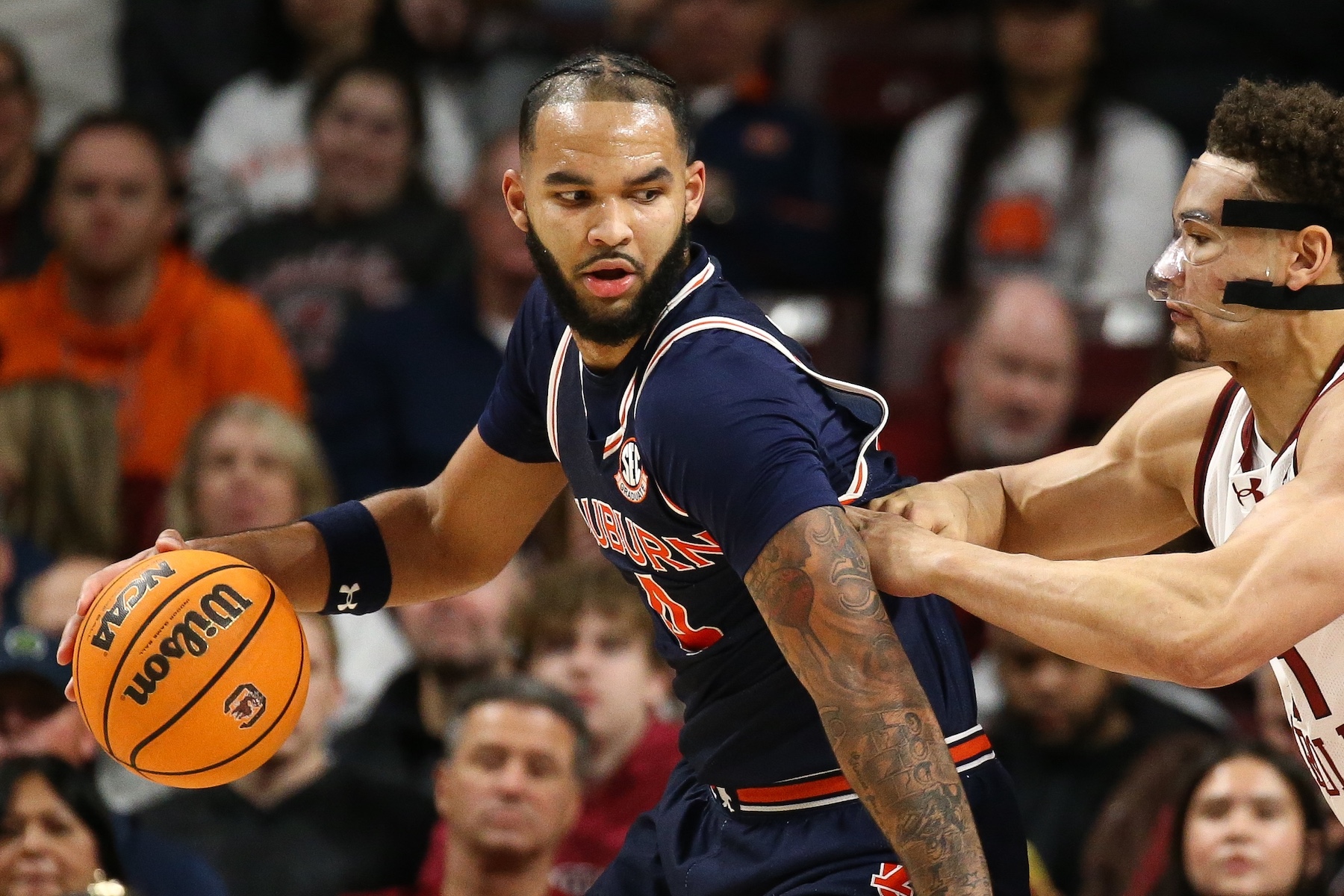 Johni Broome #4 of the Auburn Tigers moves the ball against Benjamin Bosmans-Verdonk #31 of the South Carolina Gamecocks during the first half at Colonial Life Arena on January 11, 2025 in Columbia, South Carolina. (Photo by Isaiah Vazquez/Getty Images)