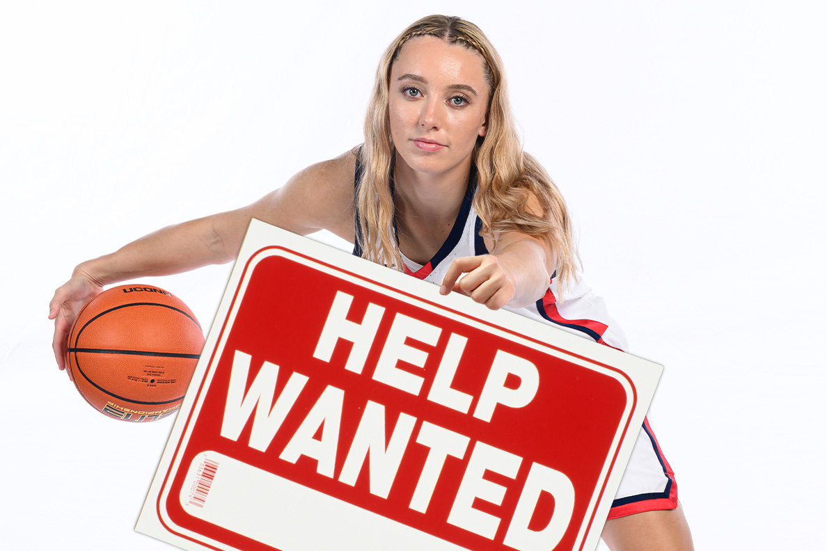 UConn guard Paige Bueckers holding a Help Wanted sign