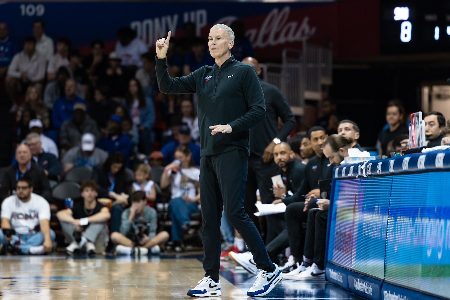 SMU Mustangs head coach Andy Enfield calls a play