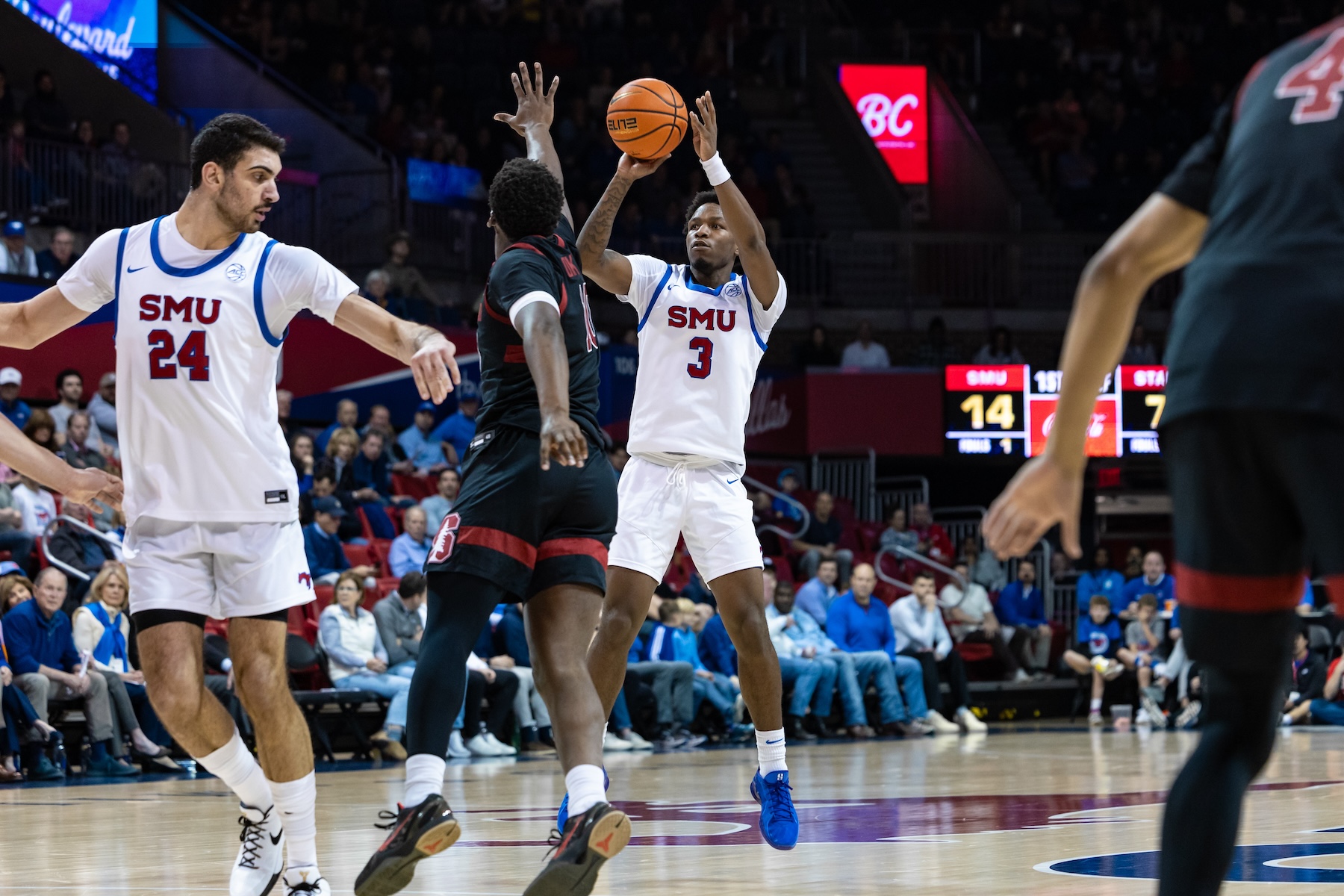 SMU Mustangs guard Chuck Harris (#3) takes a jump shot during the college basketball game