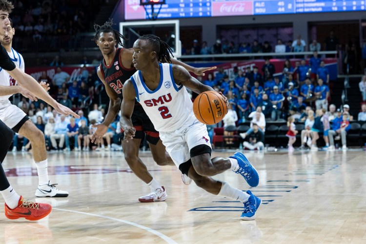 SMU Mustangs guard Kevin "Boopie" Miller (#2) dribbles up court