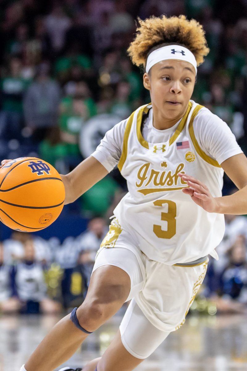 Hannah Hidalgo of Notre Dame dribbles the basketball up the floor