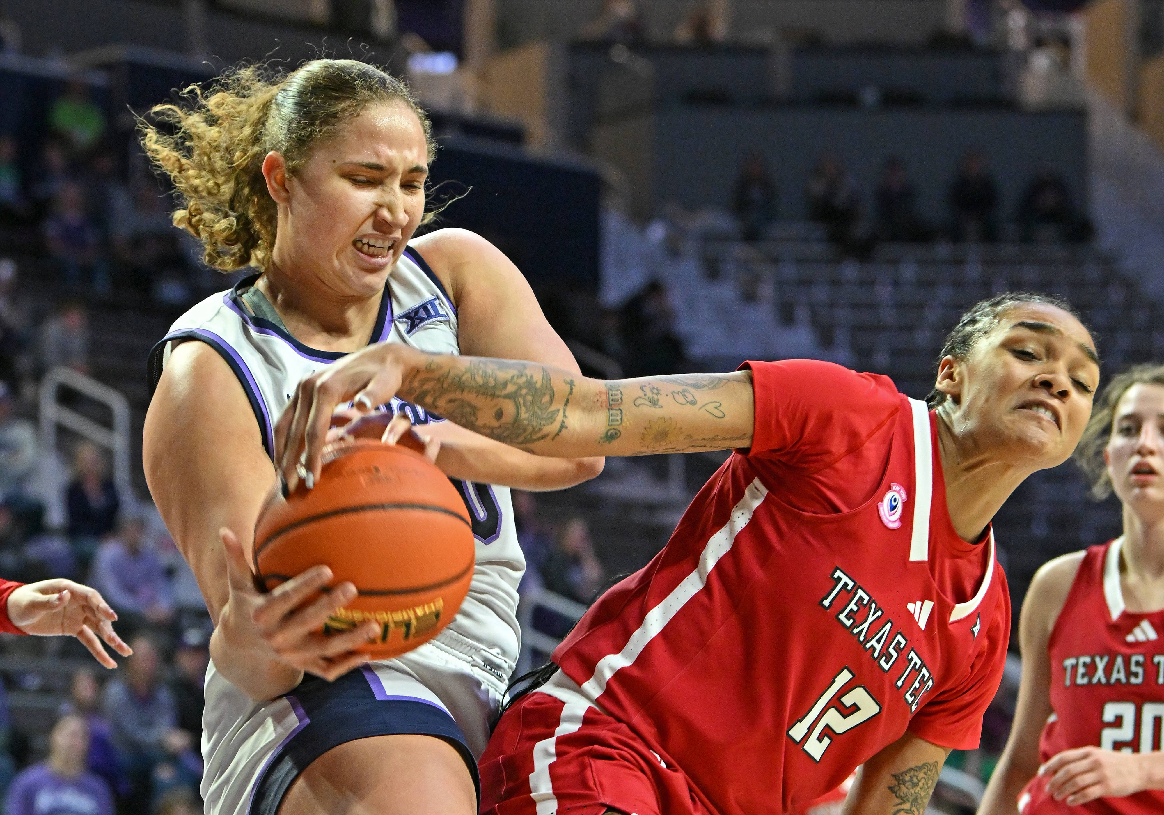 Kansas State's Ayoka Lee grapples with Jordyn Merritt in a January bout against Texas Tech