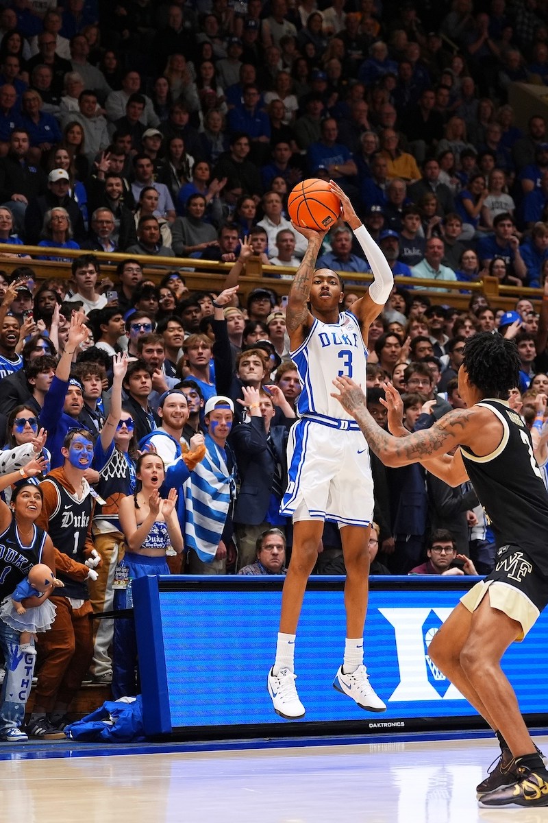 Isaiah Evans #3 of the Duke Blue Devils attempts a three-point shot against the Wake Forest Demon Deacons