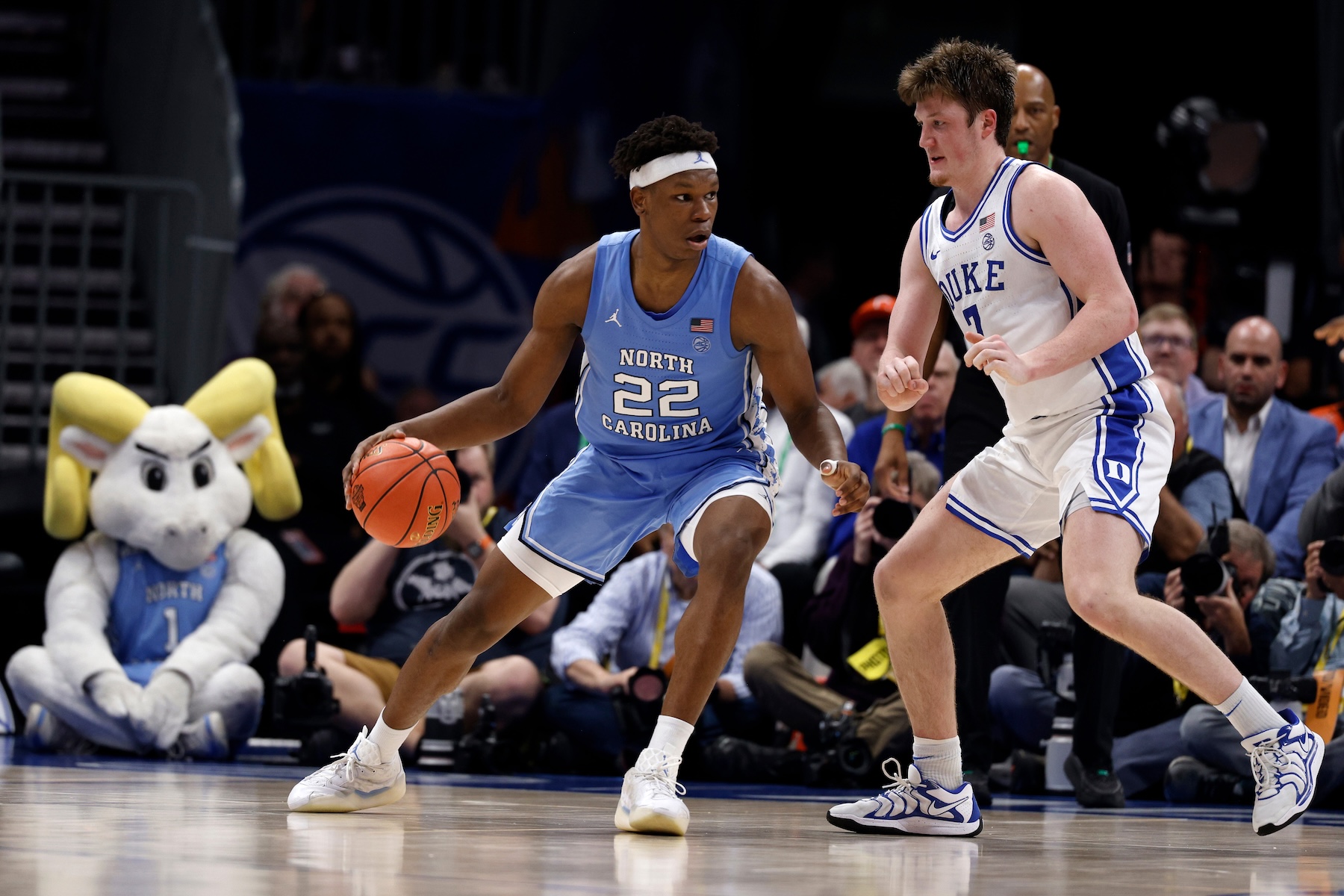 Ven-Allen Lubin #22 of the North Carolina Tar Heels moves the ball against Kon Knueppel #7