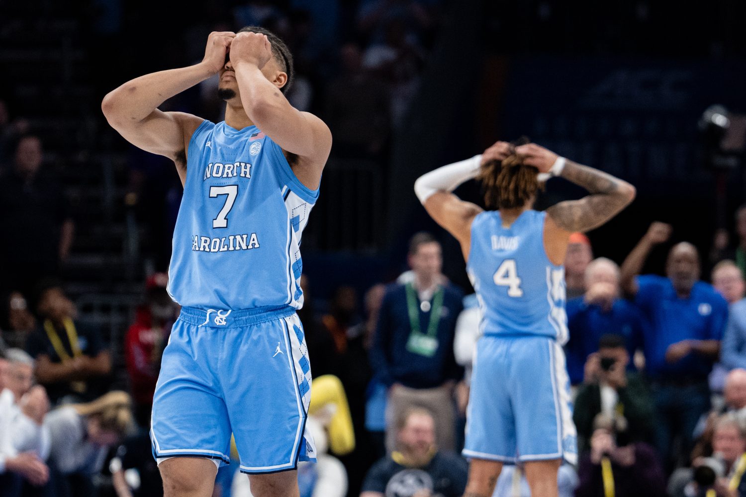 Seth Trimble #7 of the North Carolina Tar Heels and RJ Davis #4 react in the second half against the Duke Blue Devils during the semifinal round of the ACC men's basketball tournament at Spectrum Center on March 14, 2025 in Charlotte, North Carolina.