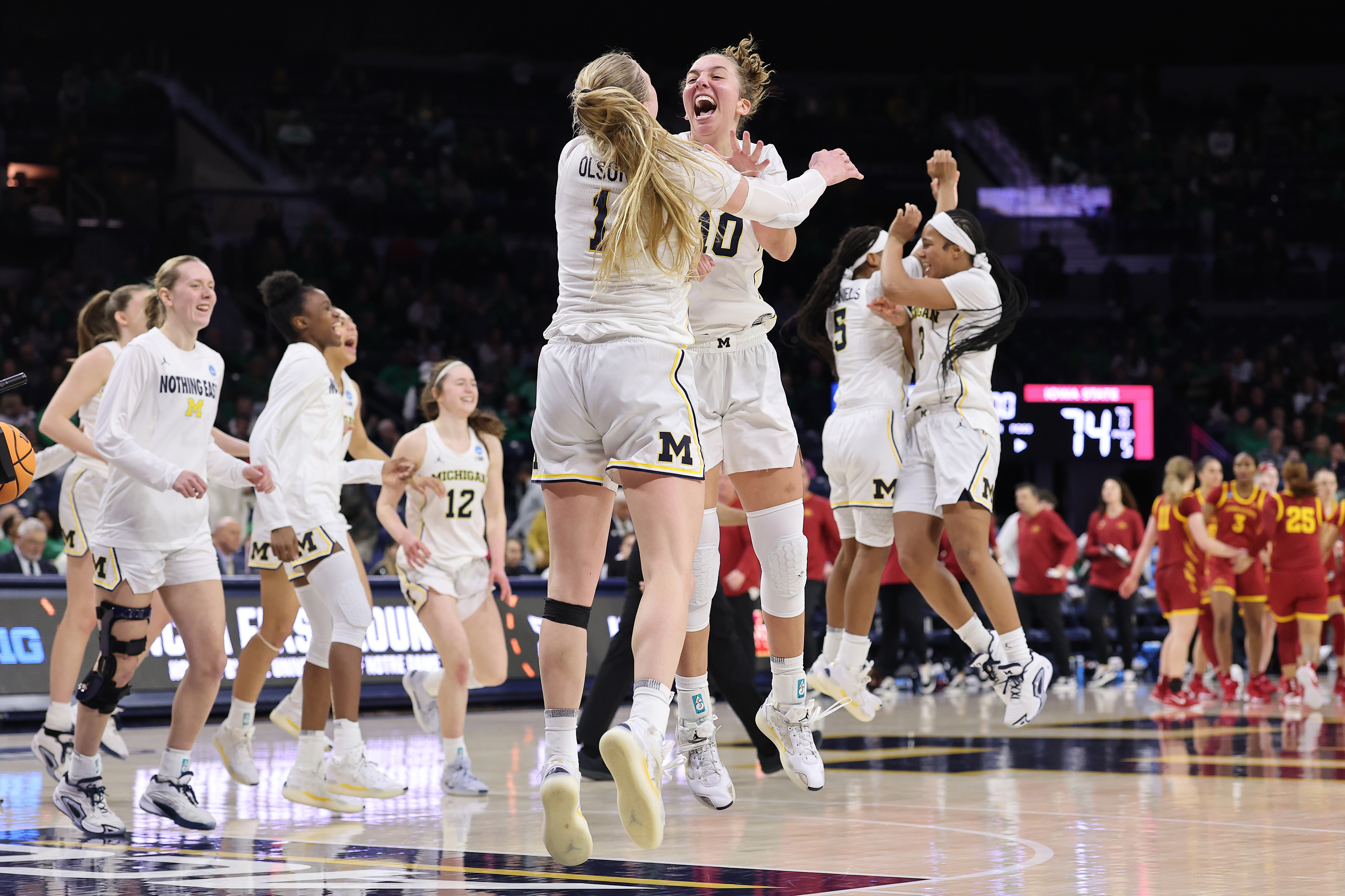 Jordan Hobbes celebrates after Michigan's victory over Iowa State on Friday