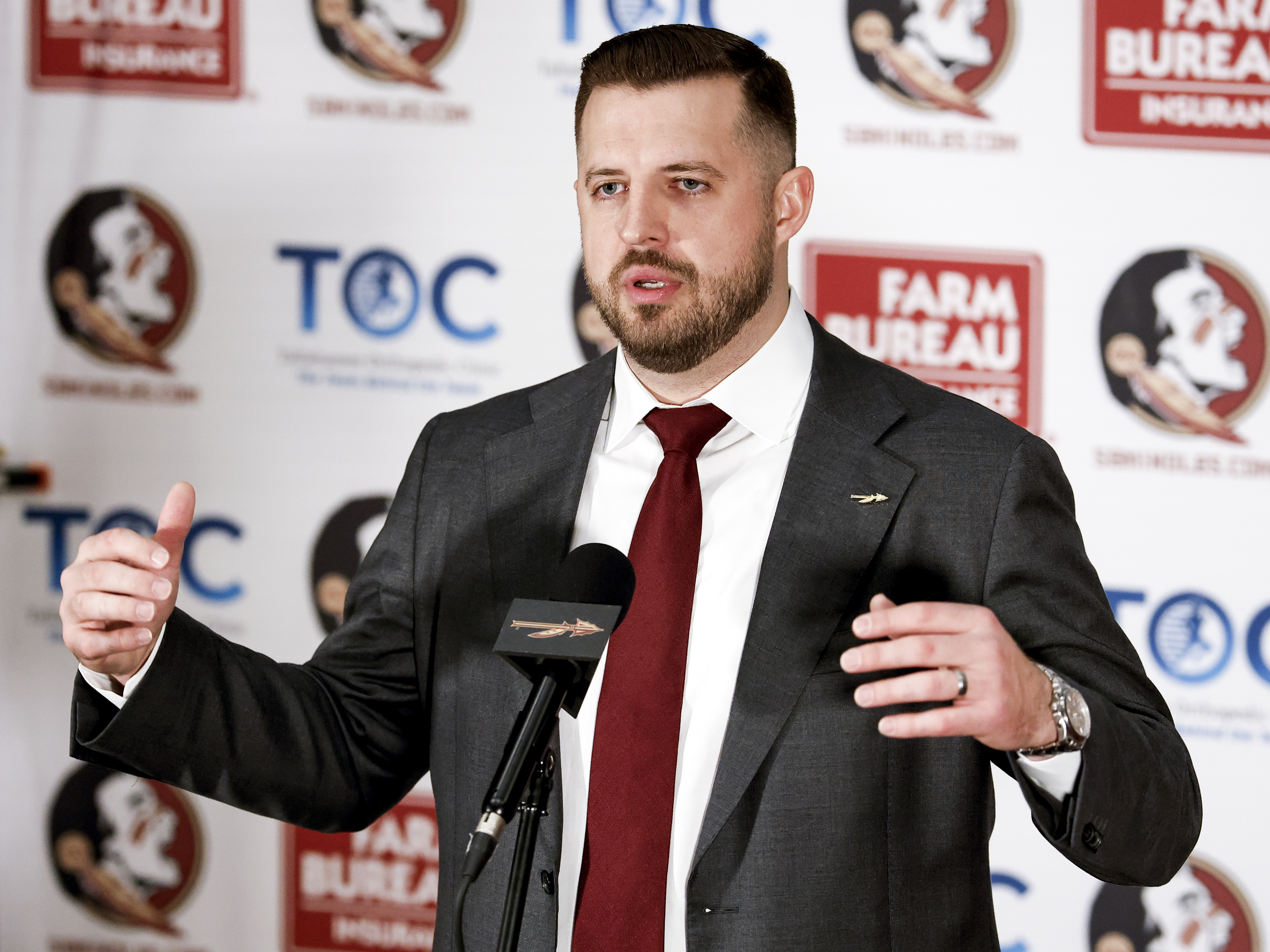 Luke Loucks speaks during a introductory press conference where he is introduced as the head coach at Florida State.