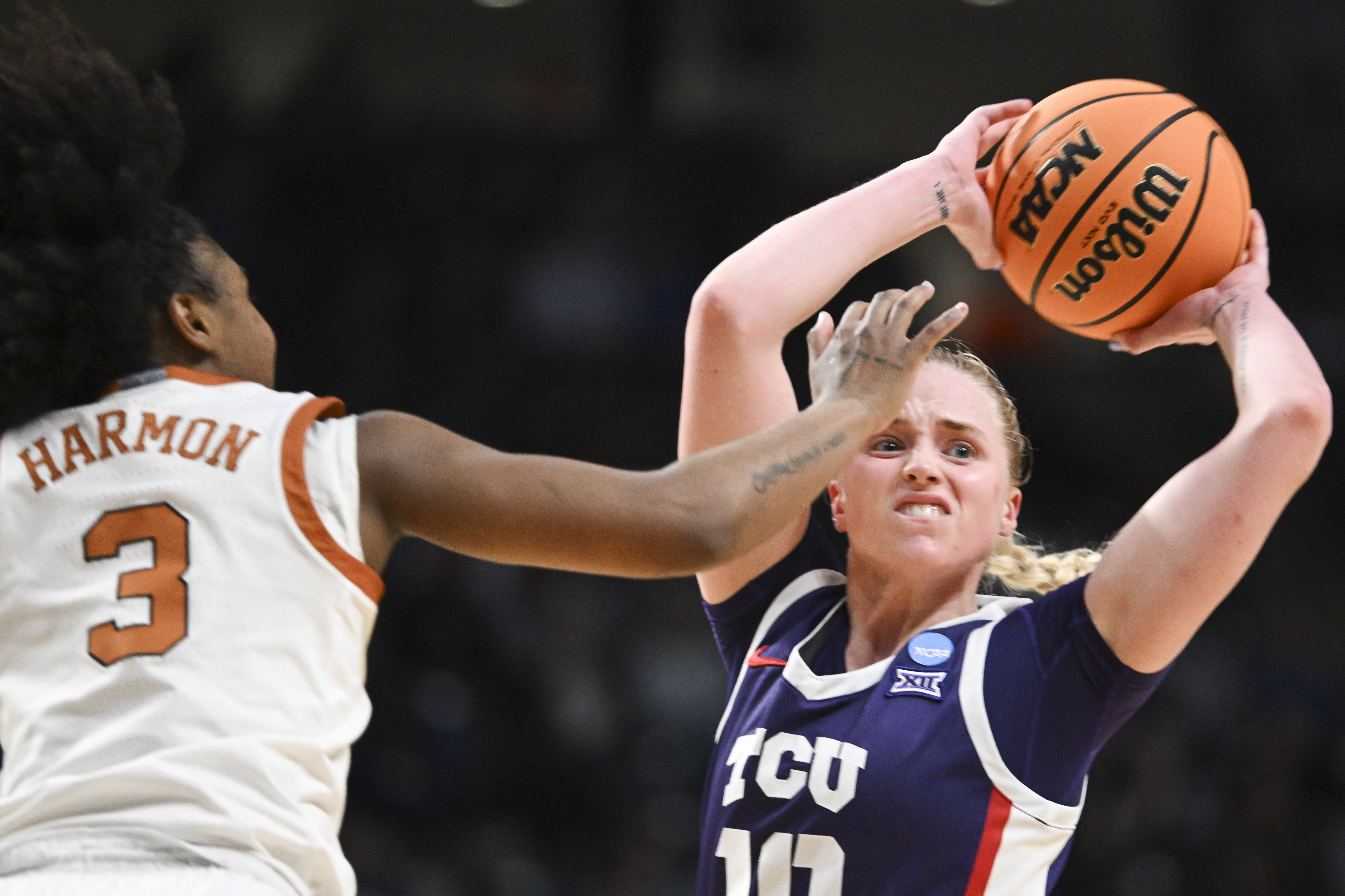 TCU basketball player Hailey Van Lith is defended by Rori Harmon of the Texas Longhorns in the Elite Eight round of the 2025 NCAA Women's Basketball Tournament held at Legacy Arena at the BJCC on March 31, 2025 in Birmingham, Alabama.
