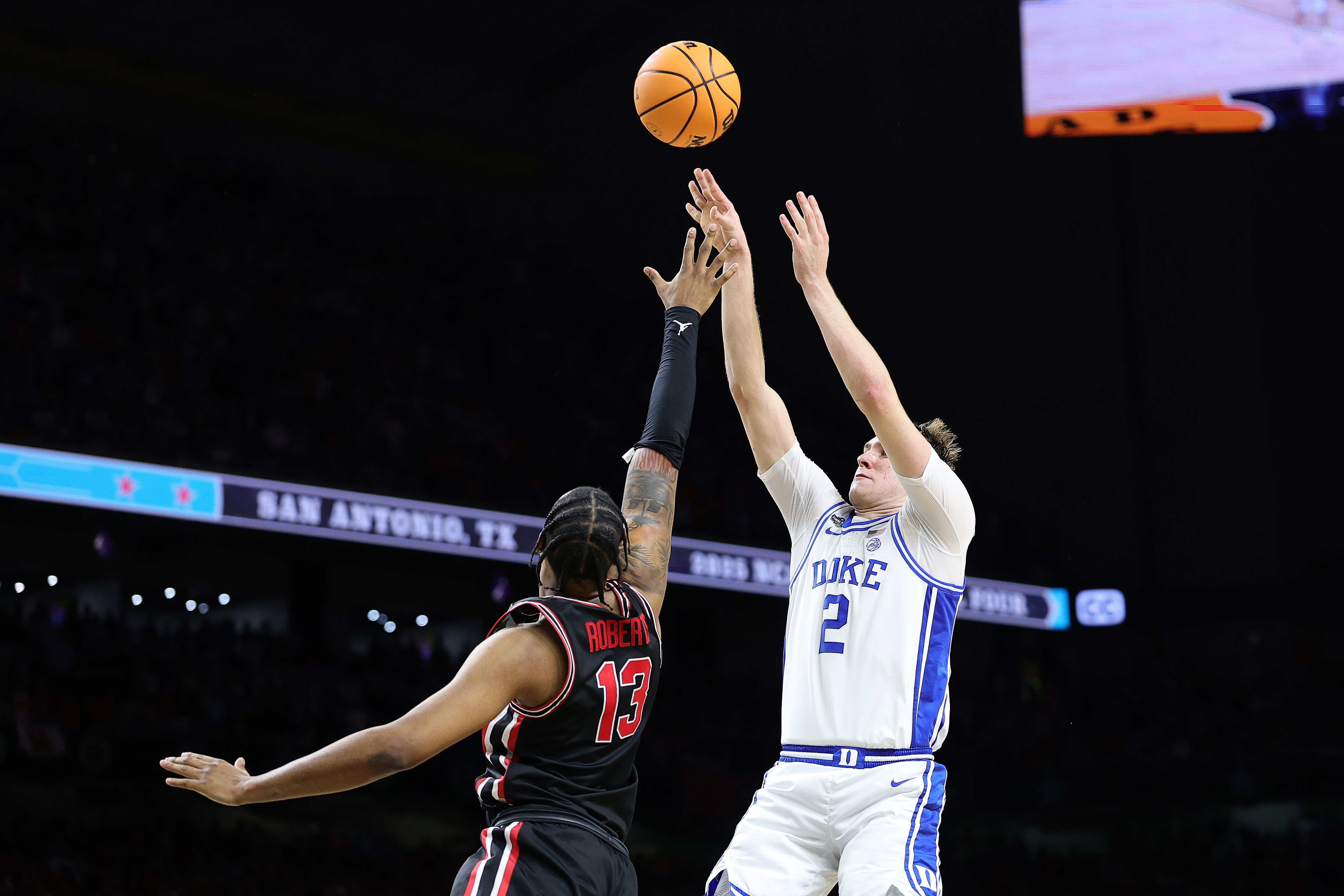 Cooper Flagg #2 of the Duke Blue Devils attempts to shoot over J'Wan Roberts #13 of the Houston Cougars during the second half in the Final Four game of the NCAA Men's Basketball Tournament at the Alamodome on April 05, 2025.