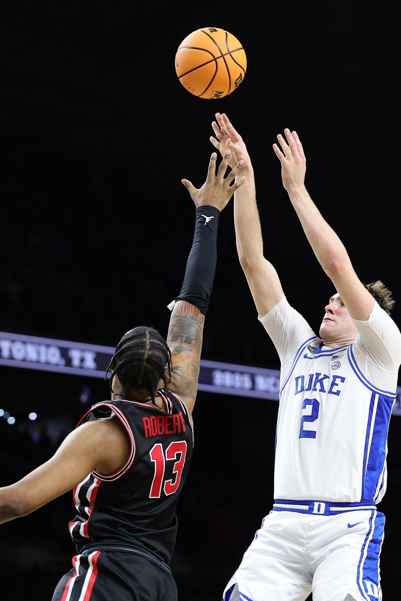 Cooper Flagg #2 of the Duke Blue Devils attempts to shoot over J'Wan Roberts #13 of the Houston Cougars during the second half in the Final Four game of the NCAA Men's Basketball Tournament at the Alamodome on April 05, 2025.