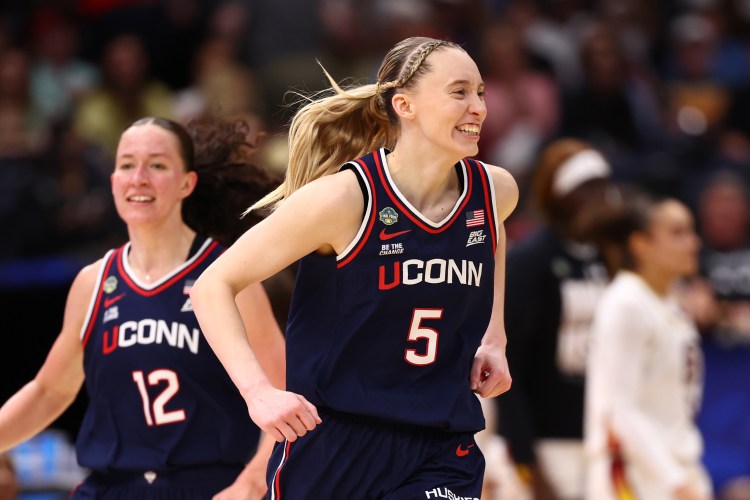 Paige Bueckers #5 of the UConn Huskies celebrates in the fourth quarter against the South Carolina Gamecocks in the National Championship of the NCAA Women's Basketball Tournament at Amalie Arena on April 06, 2025