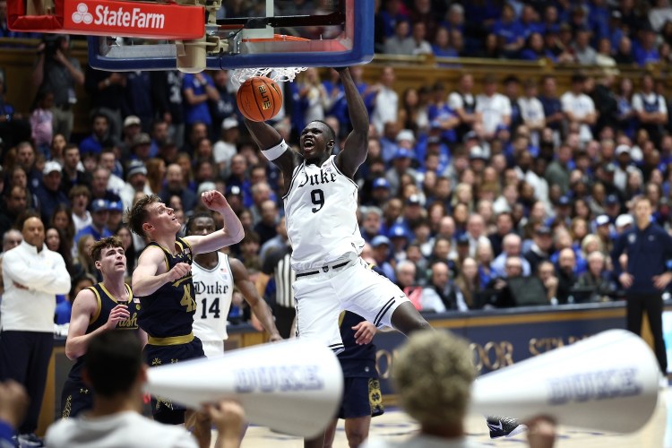 Khaman Maluach #9 of the Duke Blue Devils dunks the ball during the first half of the game against the Notre Dame Fighting Irish