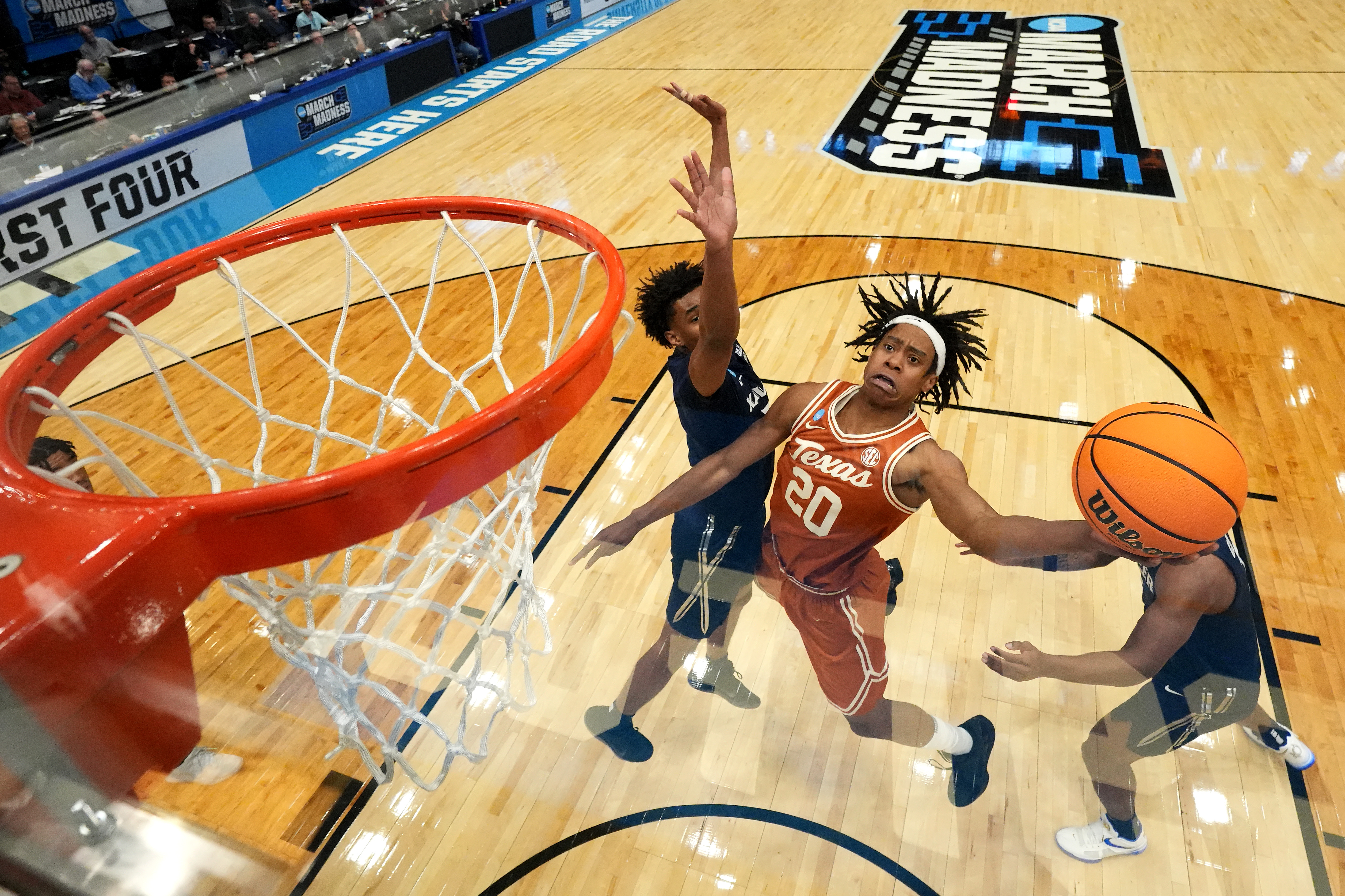 Tre Johnson leaps for a layup during Texas' First Four match against the Xavier Musketeers