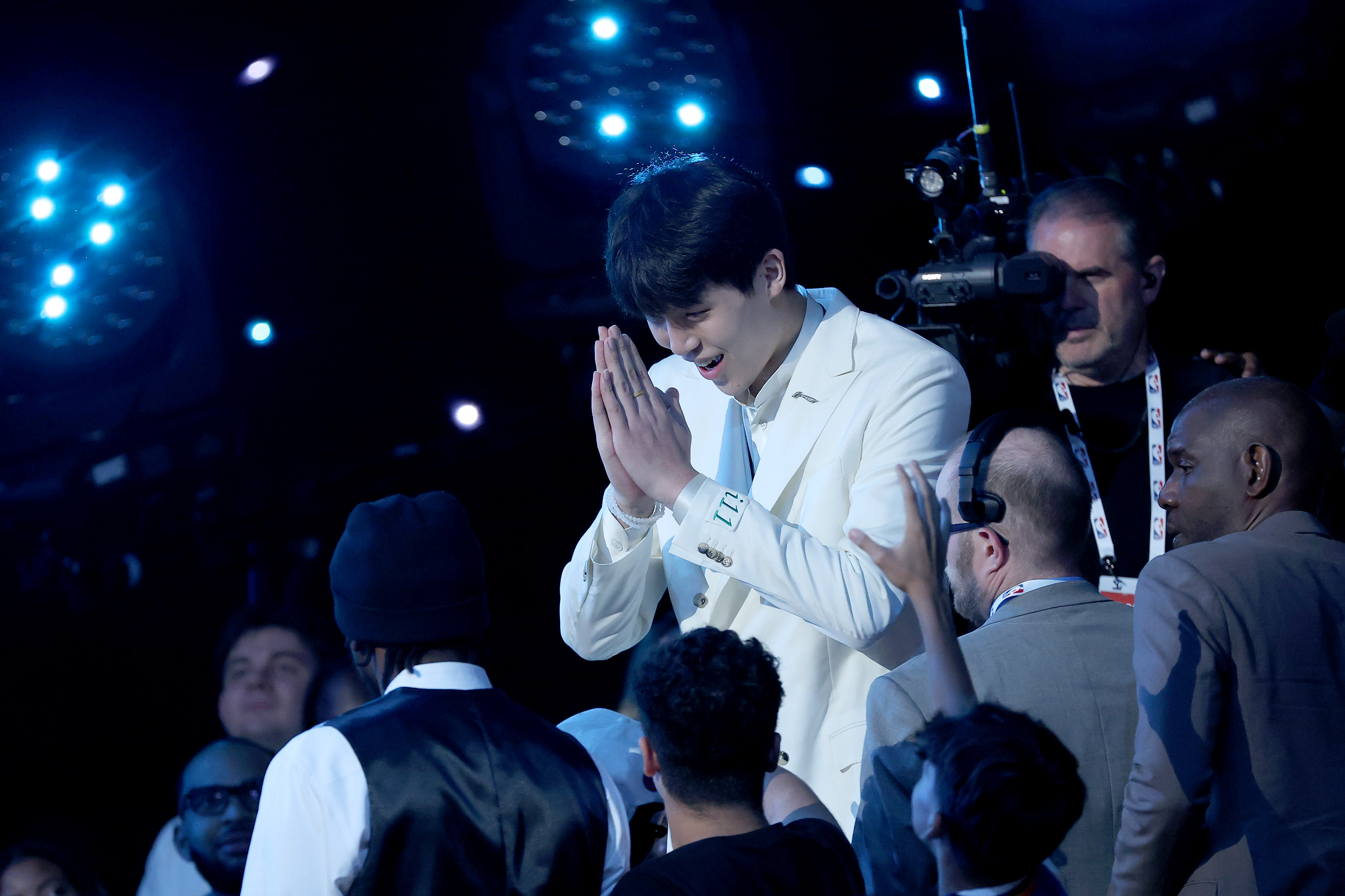 Yang Hansen climbed down from the stands after being selected 16th overall by the Memphis Grizzlies. As part of a Draft night agreement, he be traded to the Portland Trailblazers.