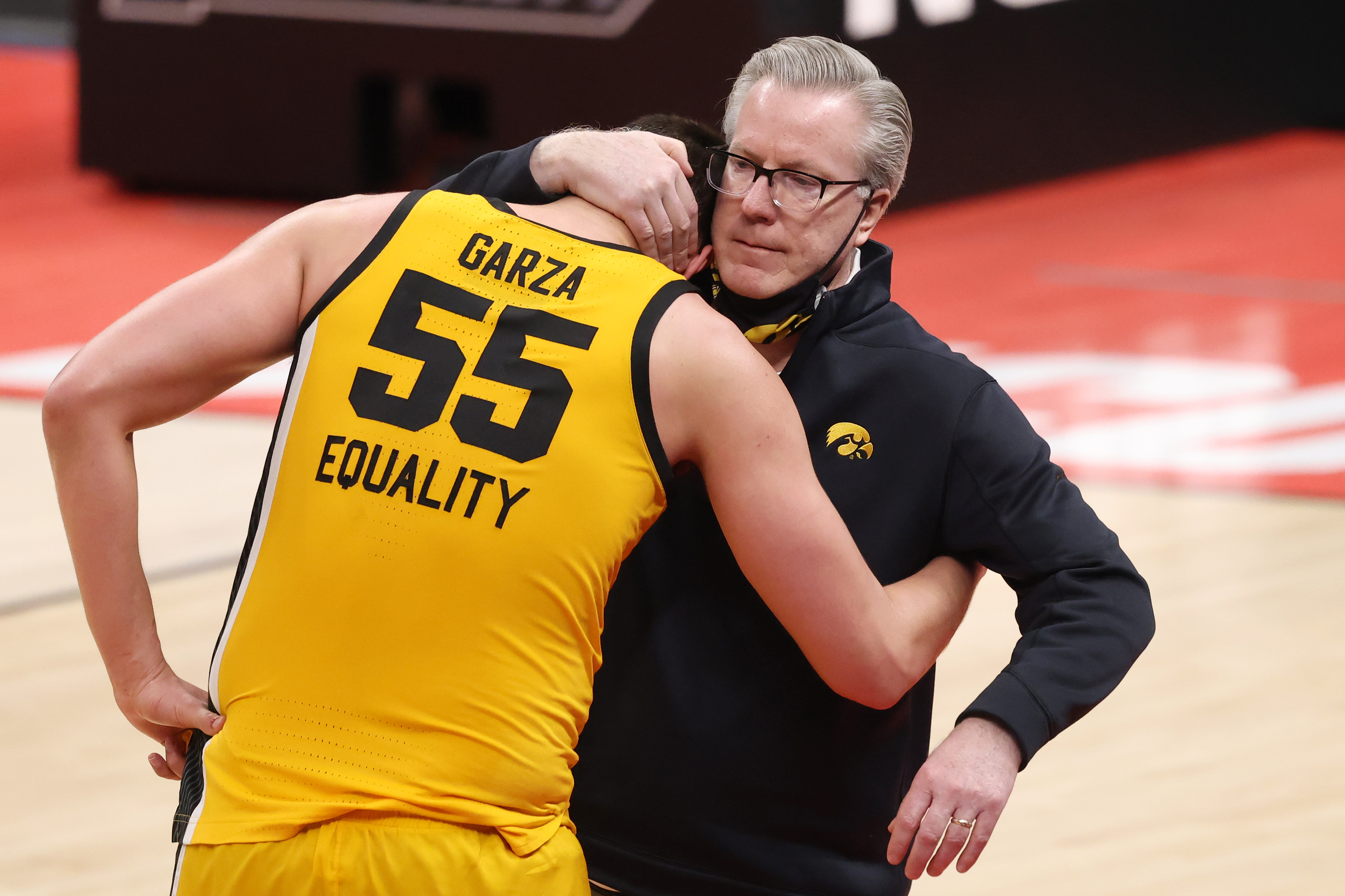 McCaffery embraces star-player Luke Garza after the Hawkeyes' 2021 Tournament loss to the Oregon Ducks