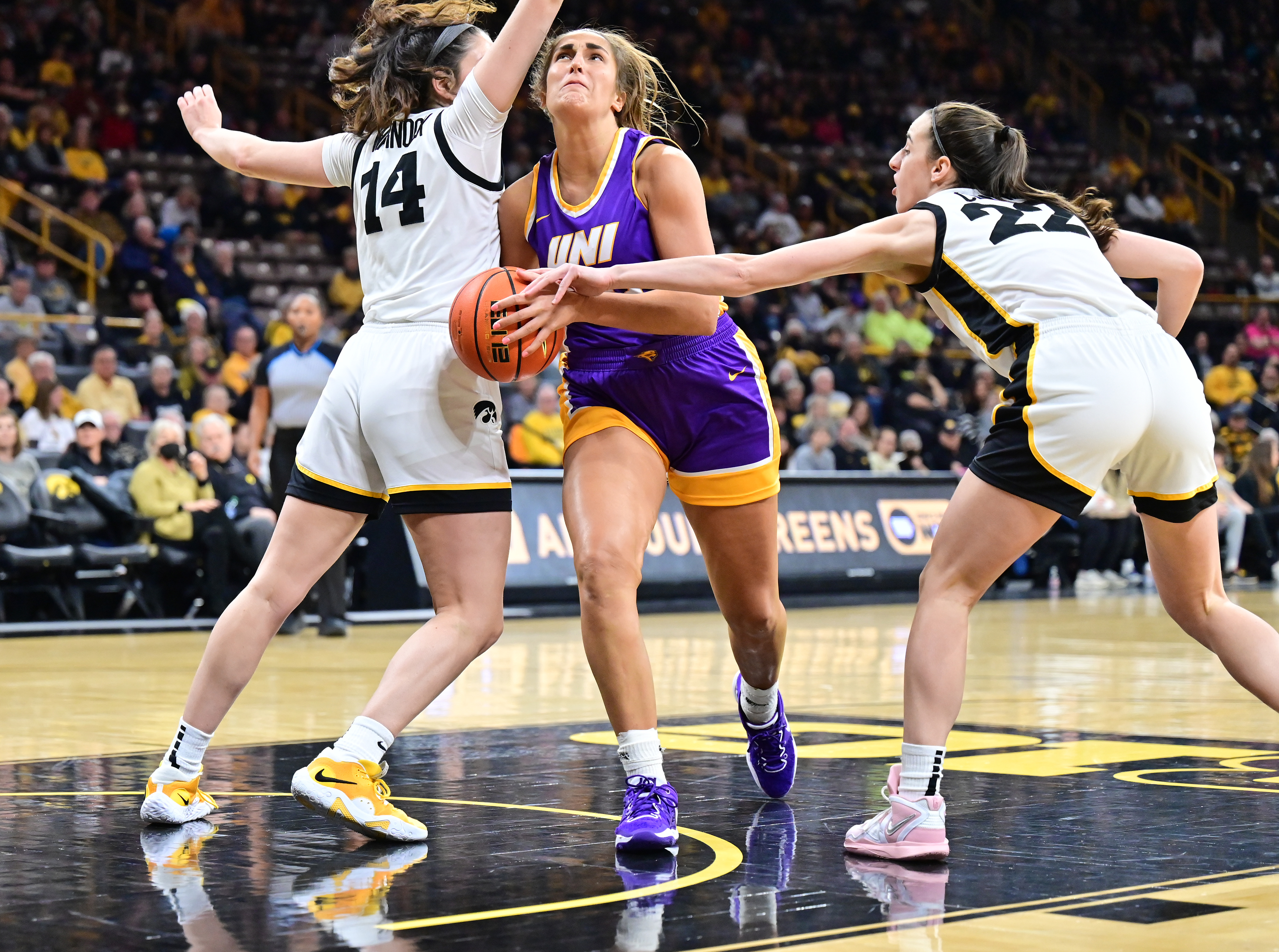 Grace Boffeli barrels through Caitlin Clark in her 2022-23 sophomore season. After a season-ending ACL tear, Creighton hopes she will become an instant impact player.