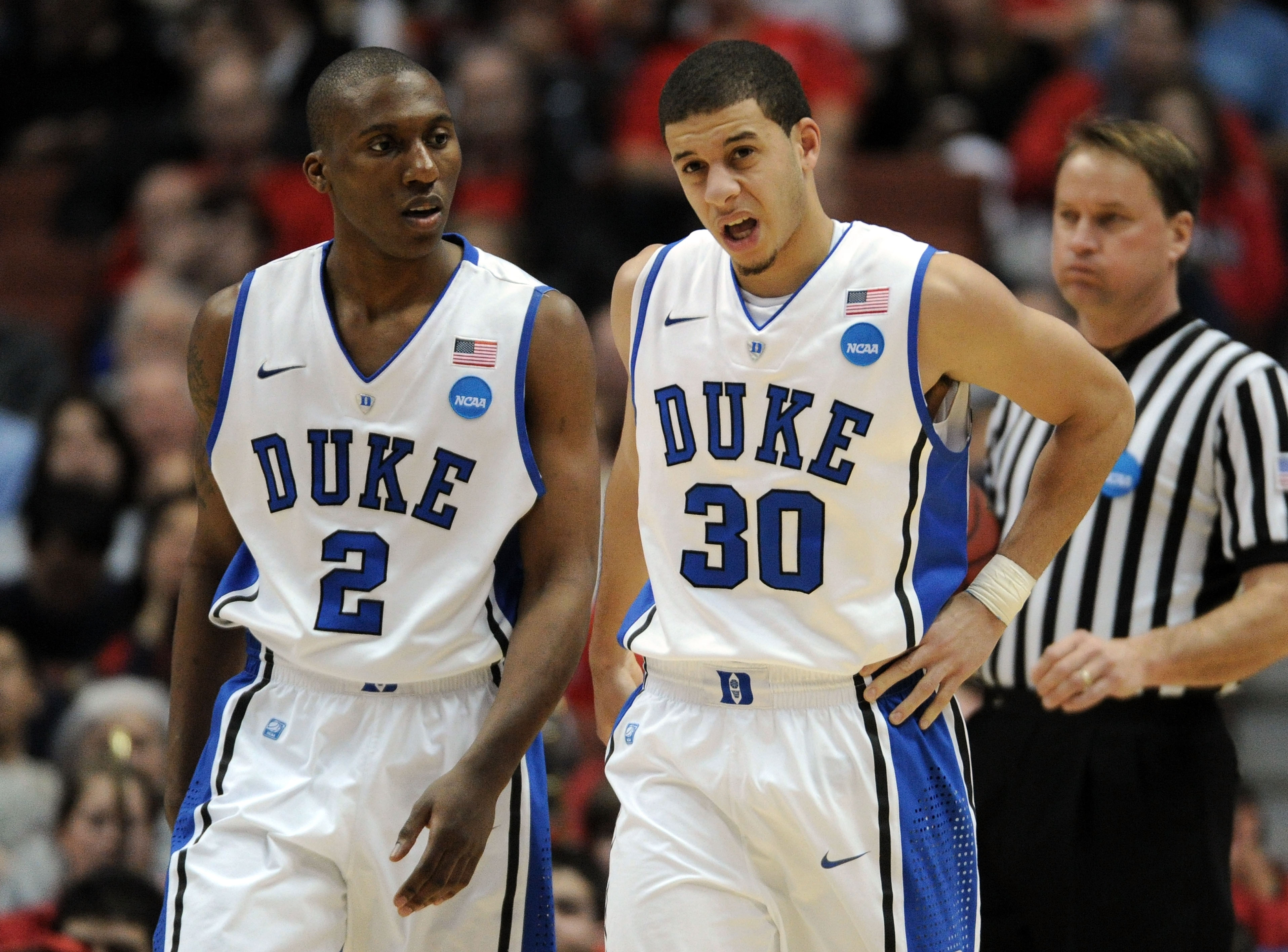 Duke captain Nolan Smith stands beside Seth Curry during the west regional semifinal of the 2011 NCAA Tournament