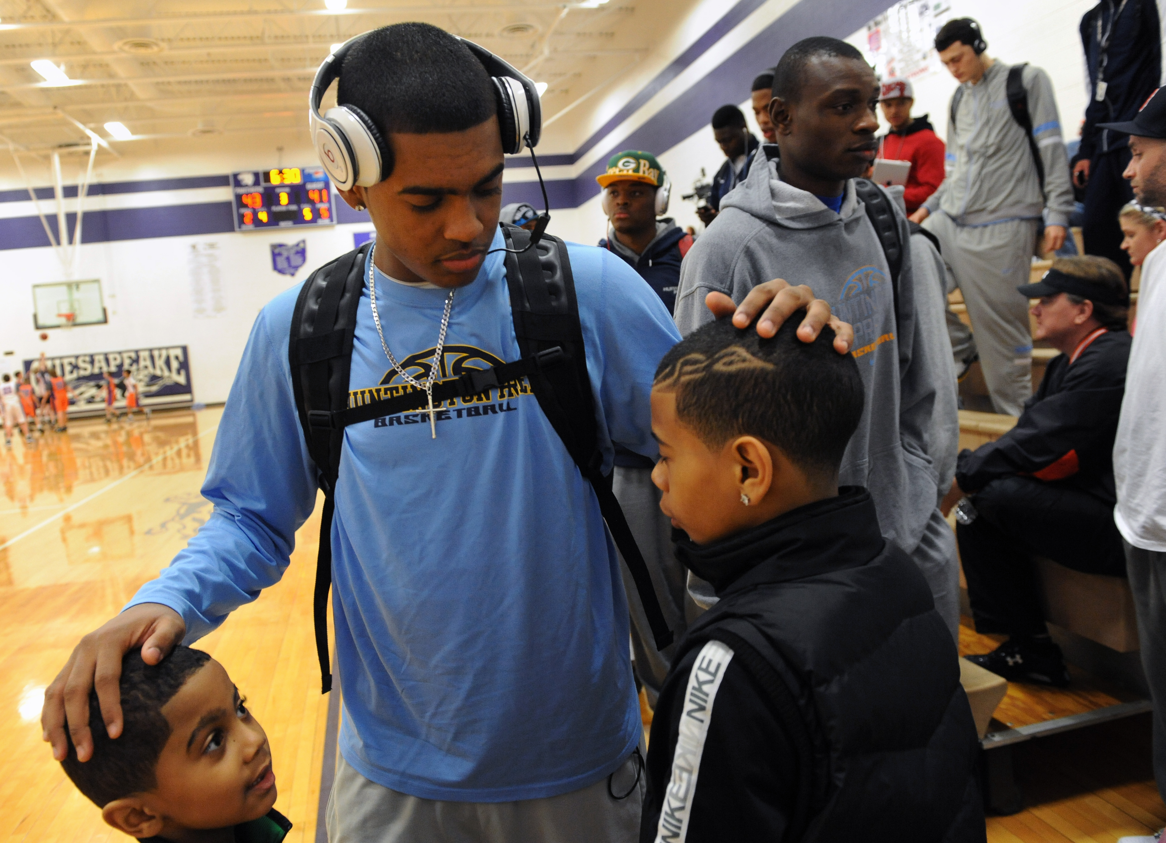 Tyrus Rathan-Mayes is pictured left beside his brother and Huntington Prep guard, Xavier. 13 years later, he's headed South to play for Wichita State.