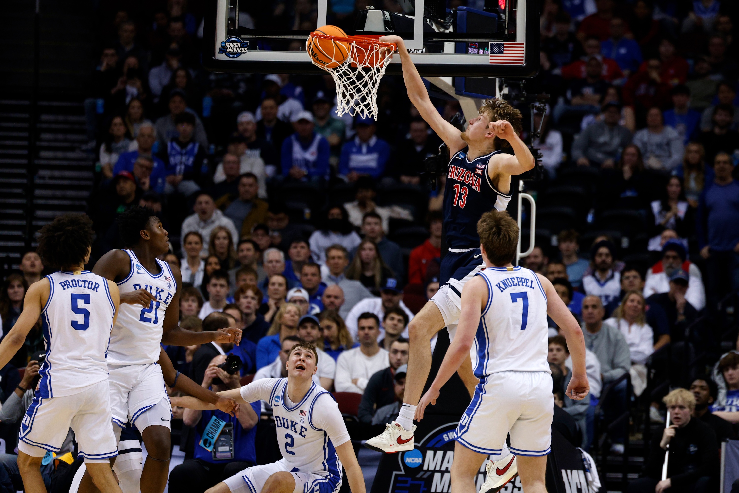 Henri Veesaar drops a thunderous dunk over Duke's Cooper Flagg and Kon Knueppel
