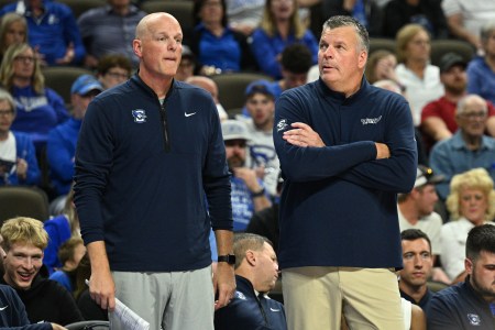 Creighton coach Greg McDermott (right) is at ease with successor Alan Huss (left) back on his bench