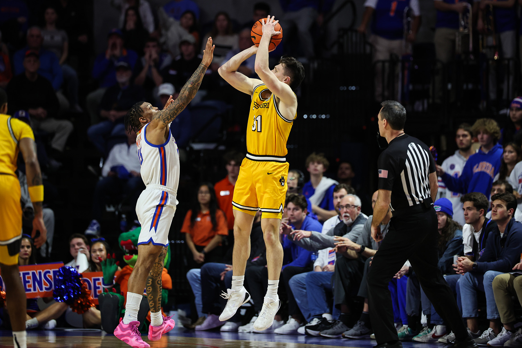 Caleb Grill rises for a three-pointer