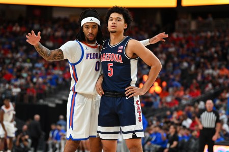 Florida Gators guard Boogie Fland and Arizona Wildcats guard Brayden Burries during a stoppage in play