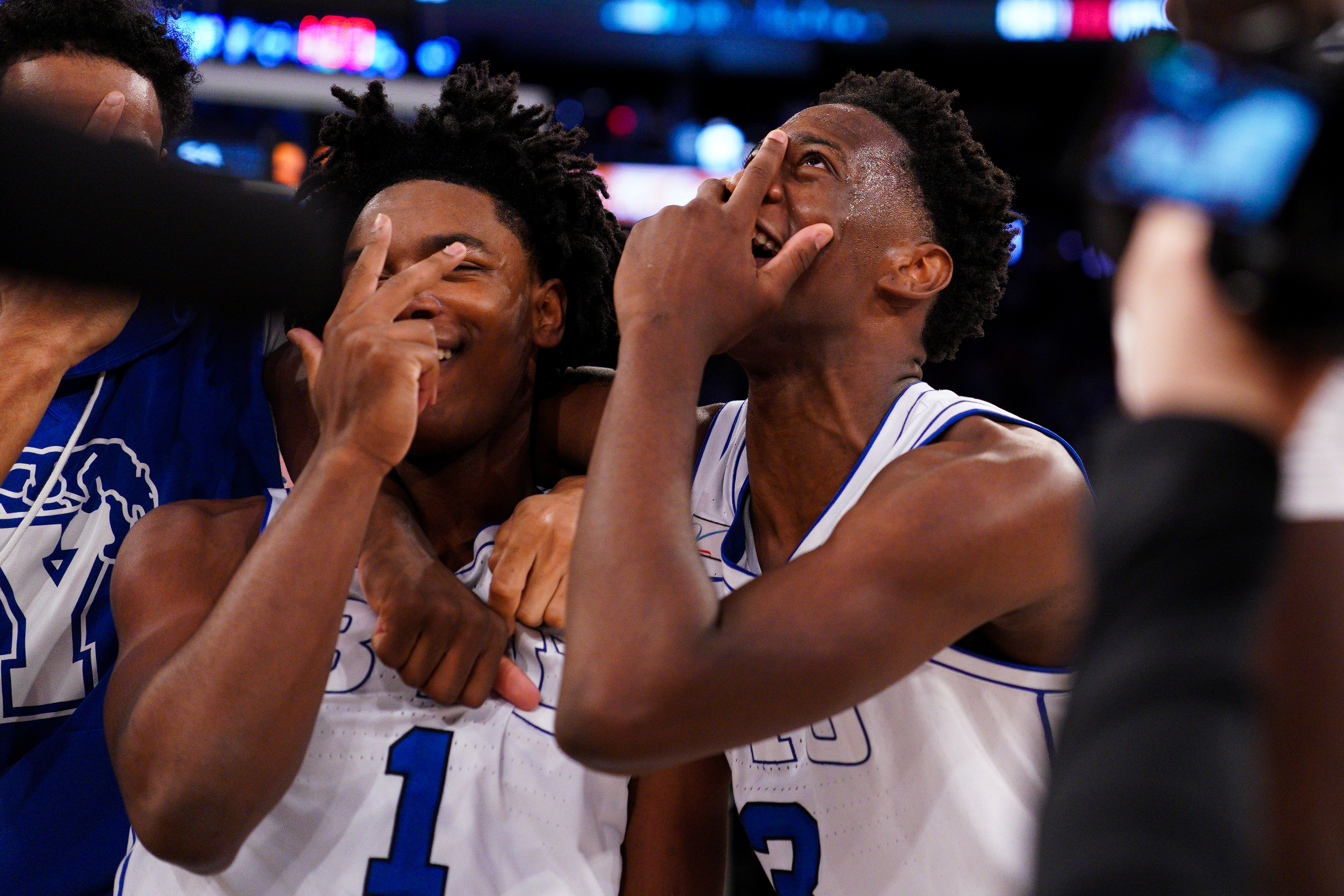 AJ Dybantsa celebrates with Robert Wright III after the first three-point buzzer beater of Wright's career
