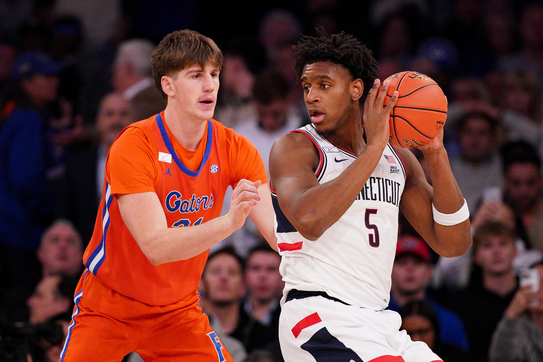 Tarris Reed Jr handles the ball on the post against Alex Condon