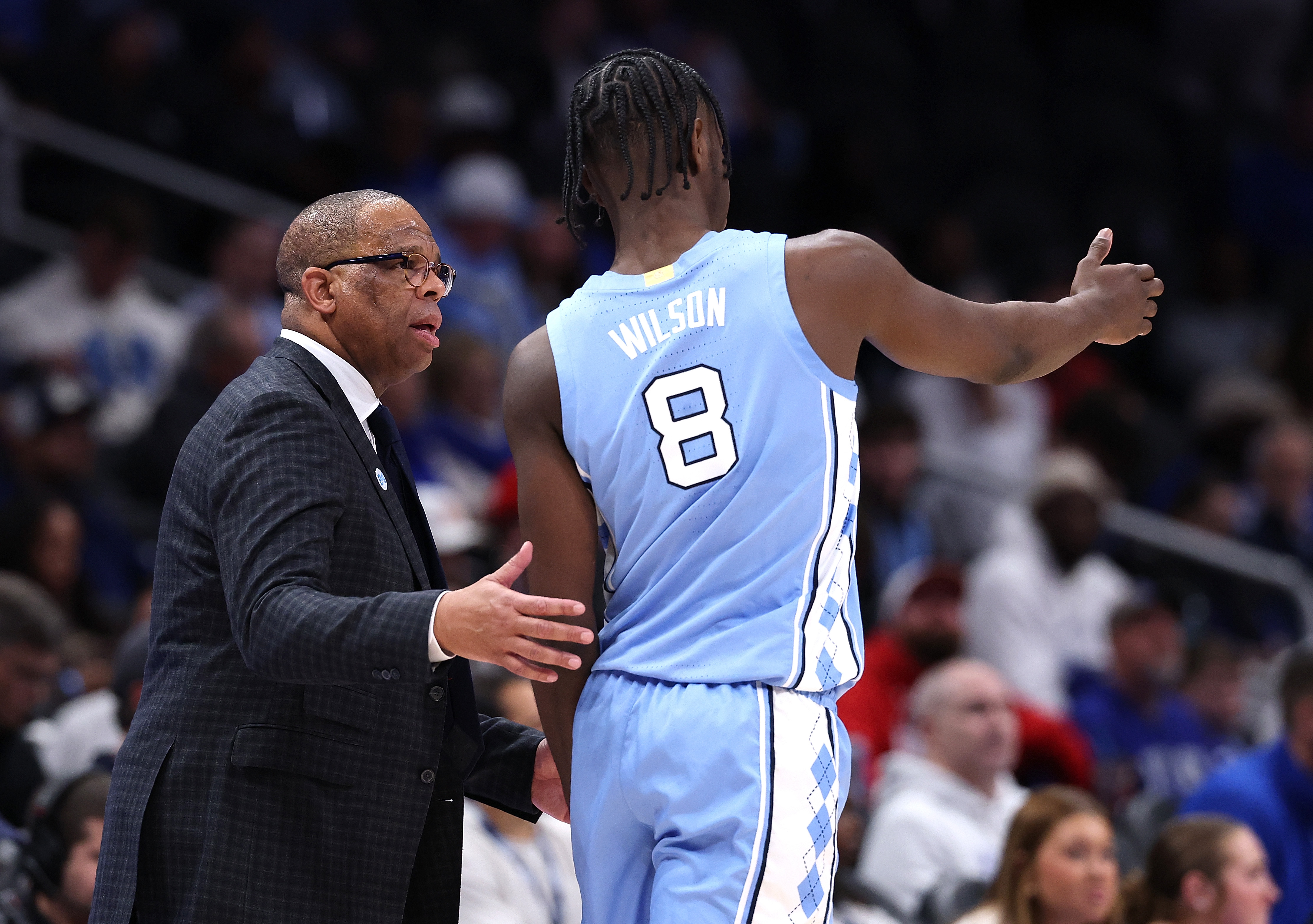 Star freshman and Wooden Award contender Caleb Wilson chats with Hubert Davis during a December victory over Ohio State