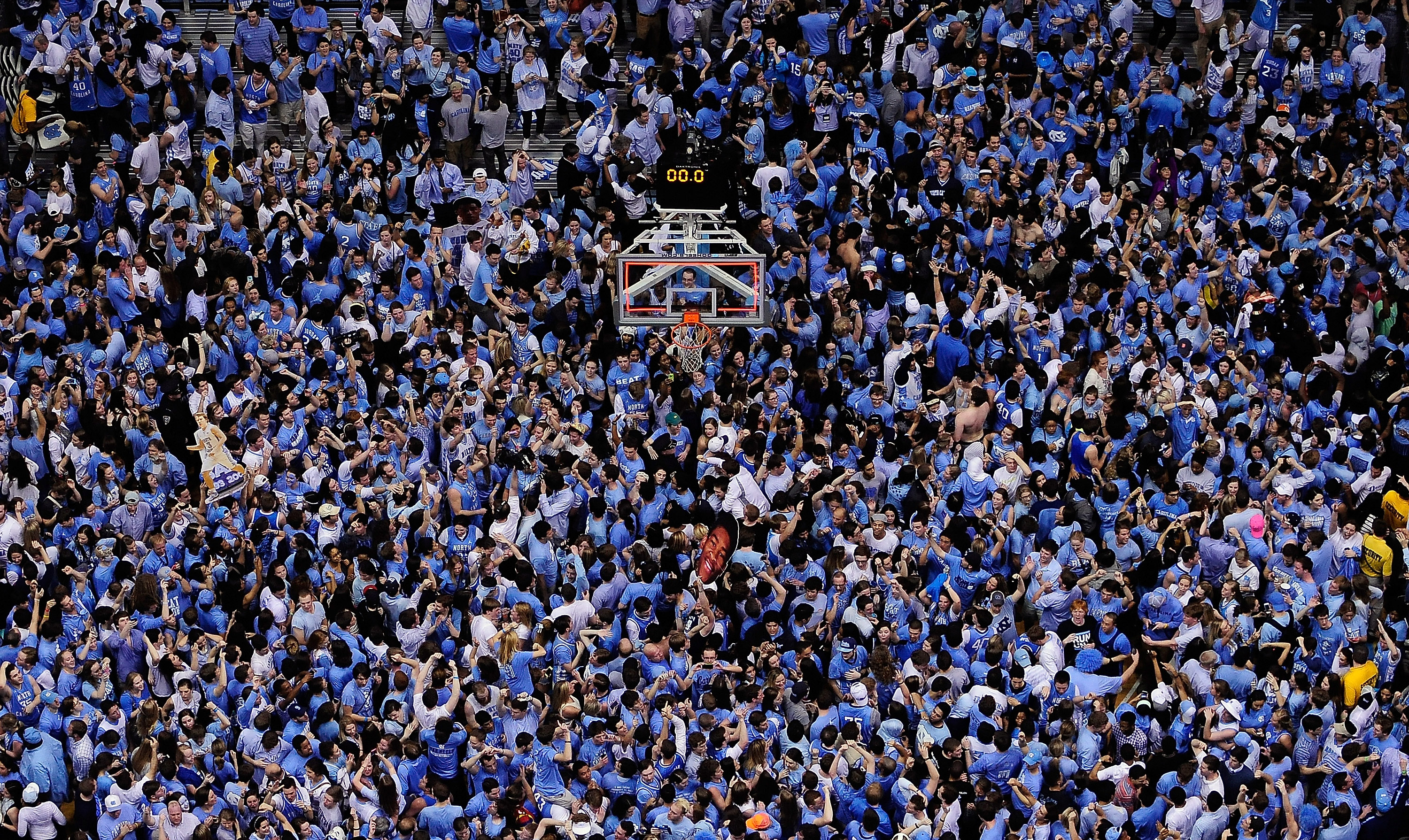 Tar Heels fans storm the court after a win over the Duke Blue Devils during their game at the Dean Smith Center on February 20, 2014.
