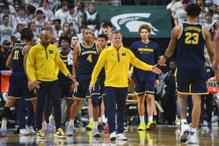Michigan coach Dusty May on the sidelines with his team