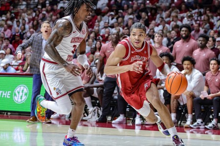 Darius Acuff Jr. of the Arkansas Razorbacks drives to the basket around Latrell Wrightsell Jr. of the Alabama Crimson Tide