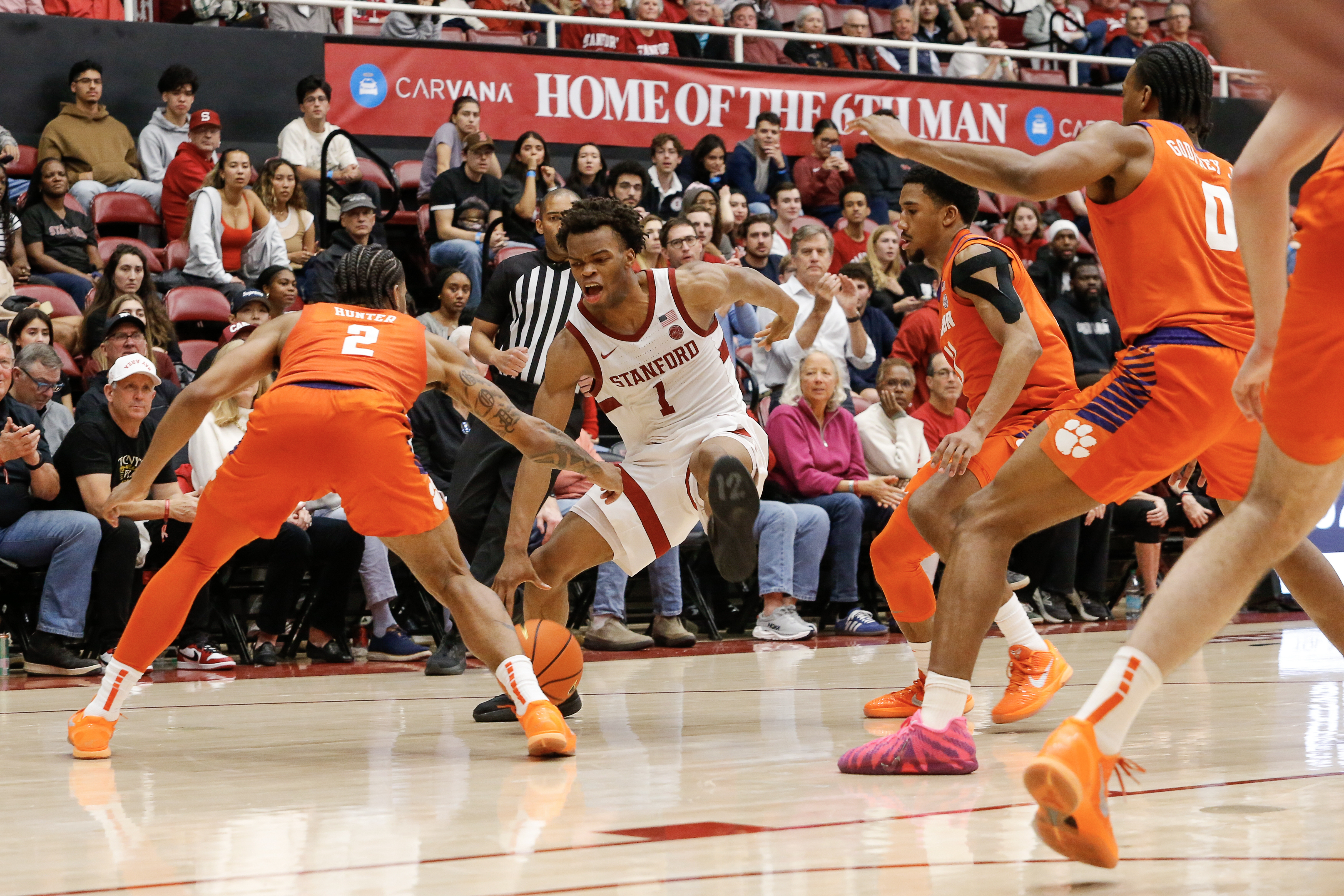 Clemson's defense — seen here swarming Stanford's Ebuka Okorie in a win on Feb. 4 — is allowing only 62.2 points per game at home in conference this season