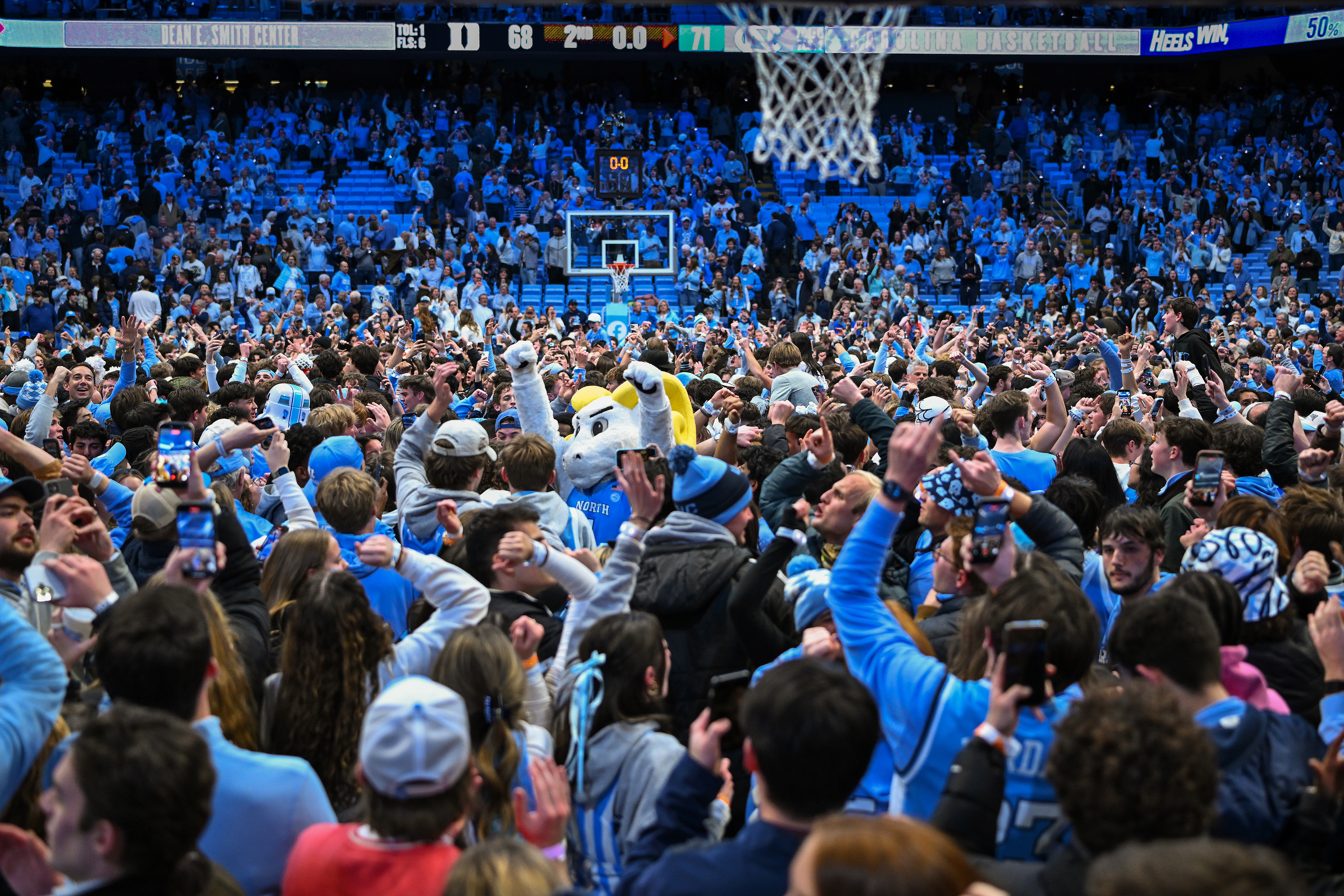 Tar Heels fans storming the court after a big upset win over rival Duke