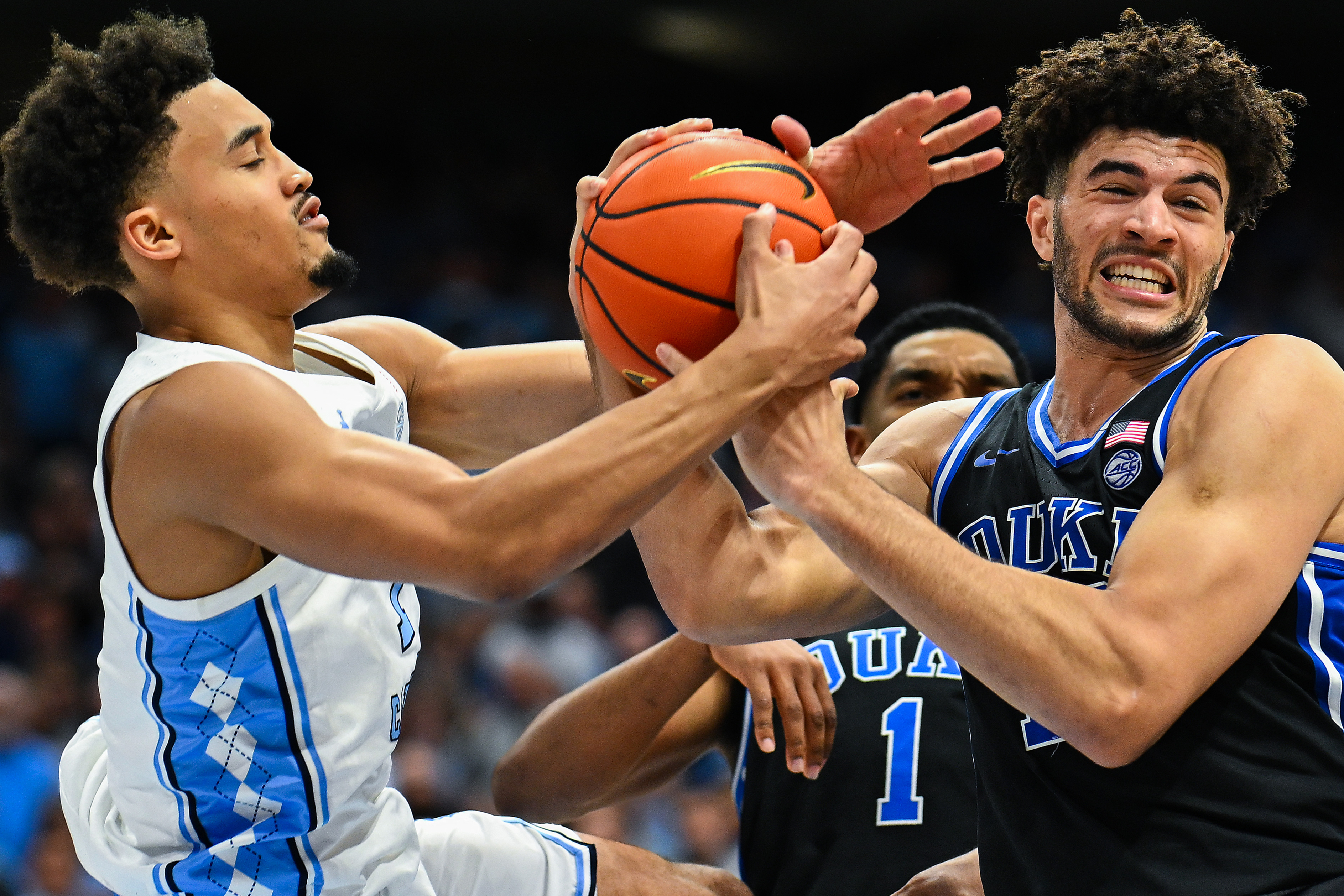 UNC's Seth Trimble, who hit the game-winning three-pointer over Duke, battles Cameron Boozer for a loose ball