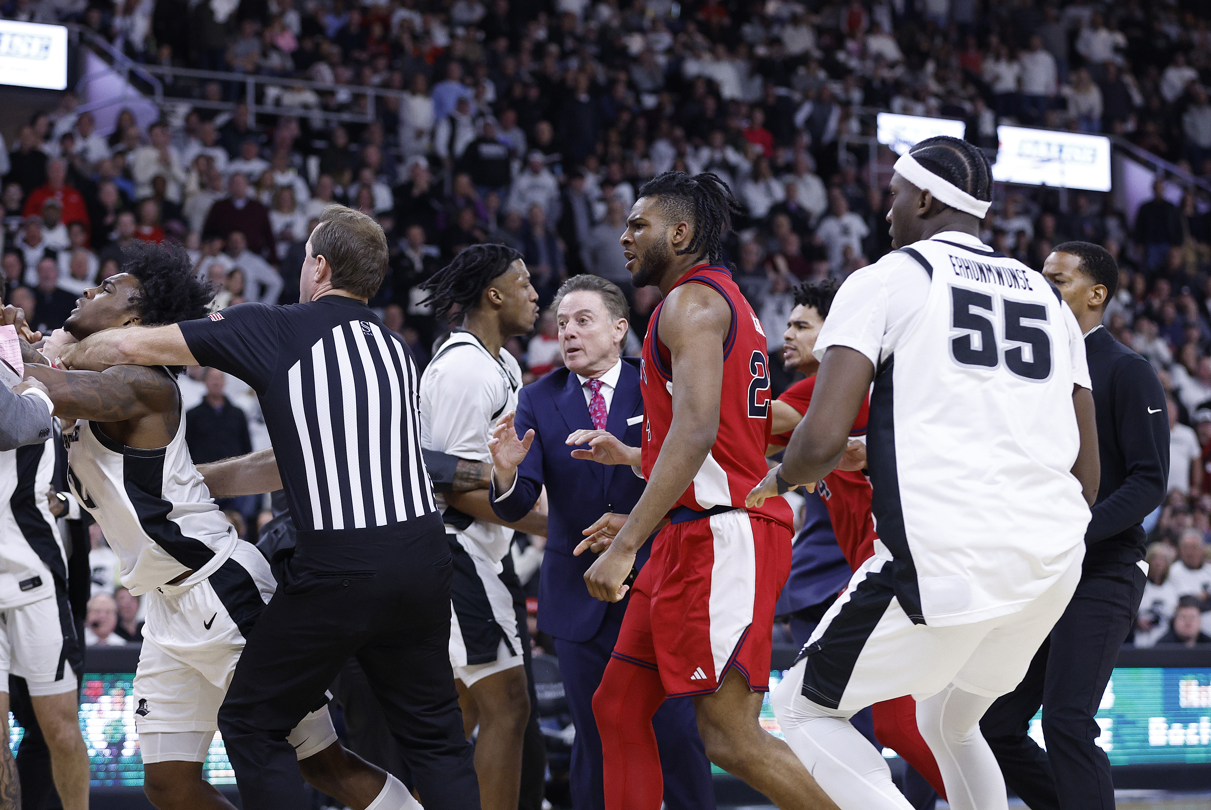 St. John's head coach Rick Pitino in the middle of the chaos that ensued after the nasty foul