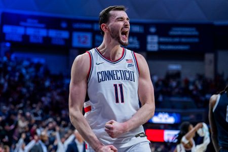 Alex Karaban cheering on the court