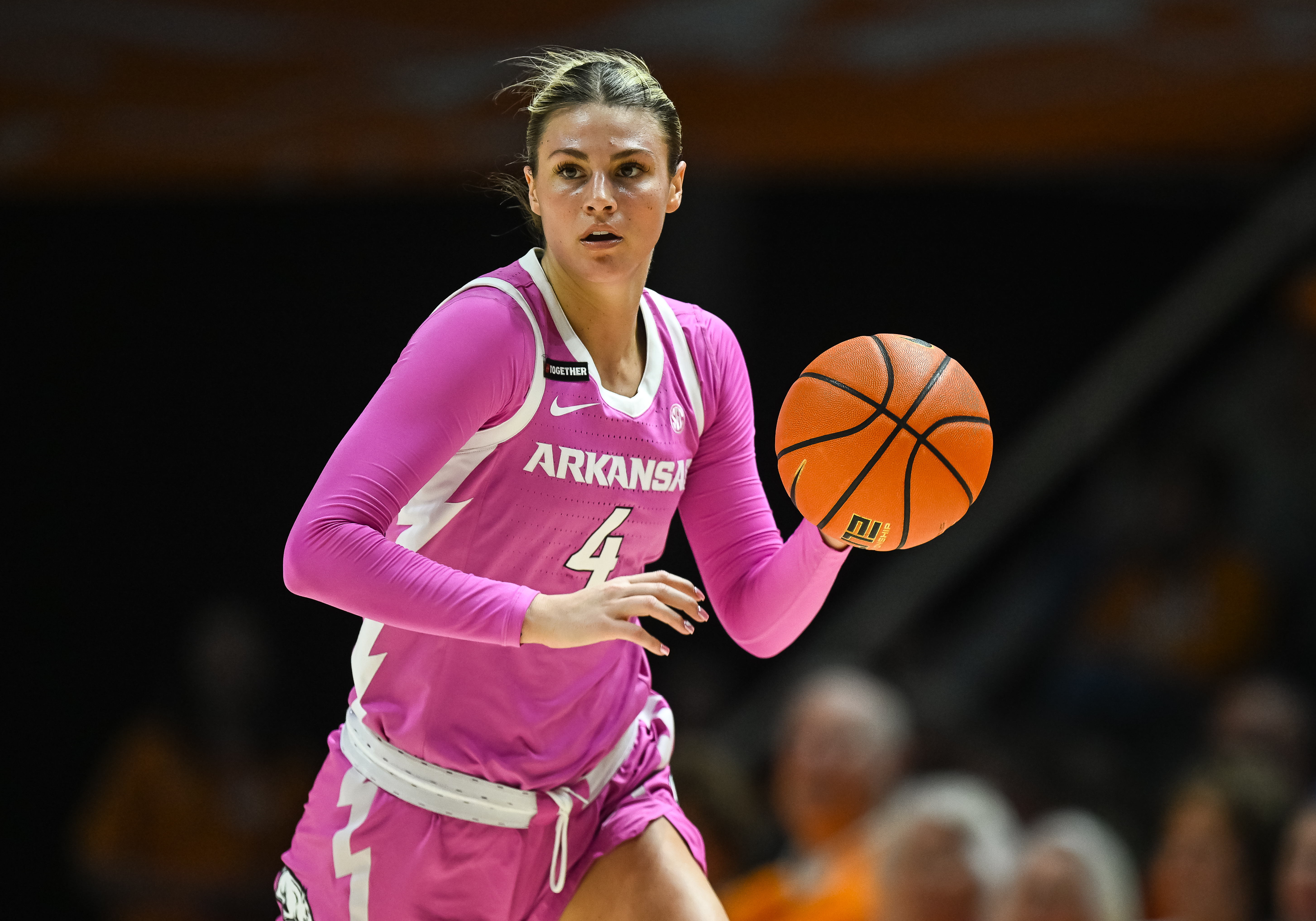 Halfway through her first college season, Saylor transfered to Arkansas, where her god sister was an assistant coach