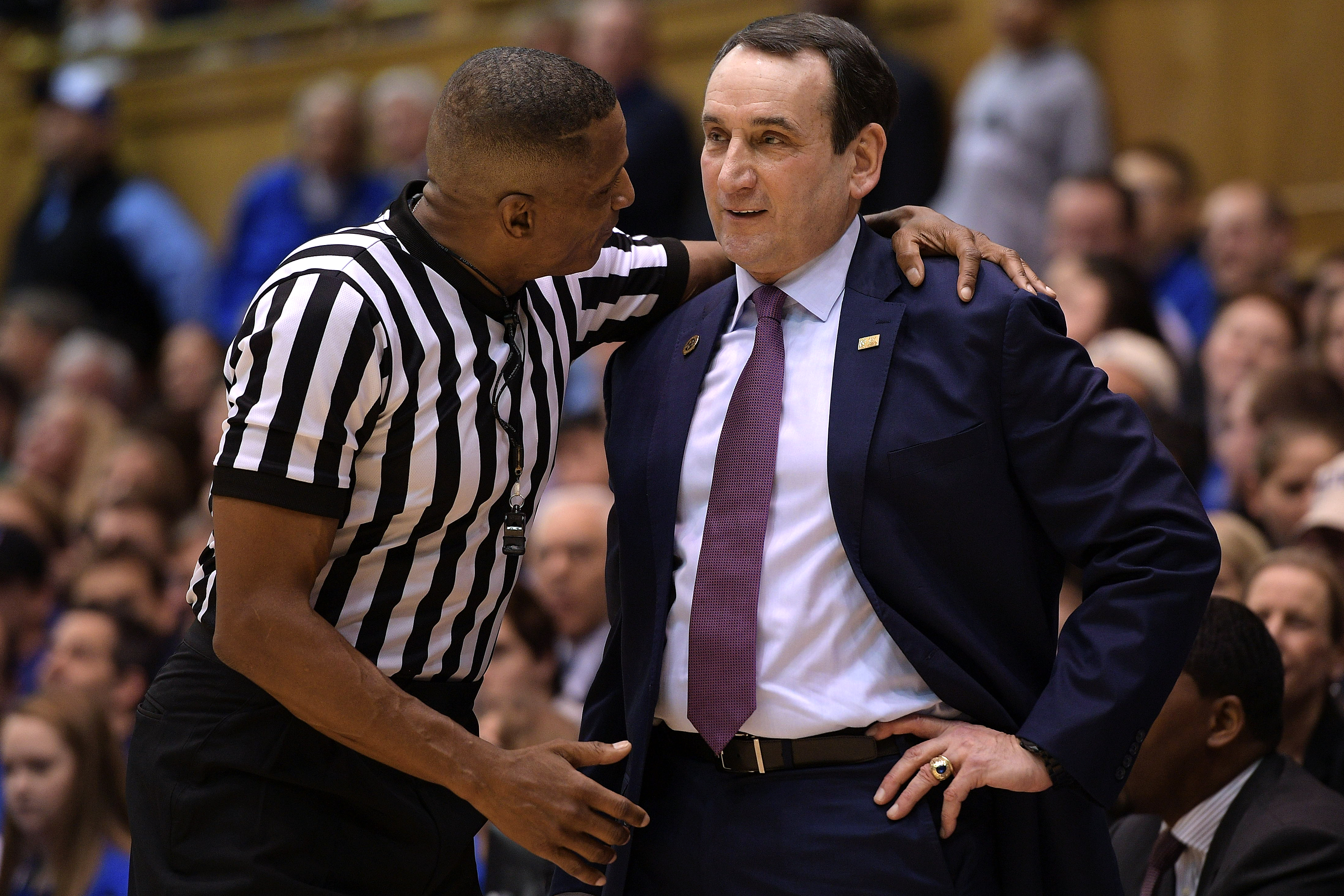 Ted Valentine speaks with Coach Mike Krzyzewski during a 2017 match between Duke and Georgia Tech