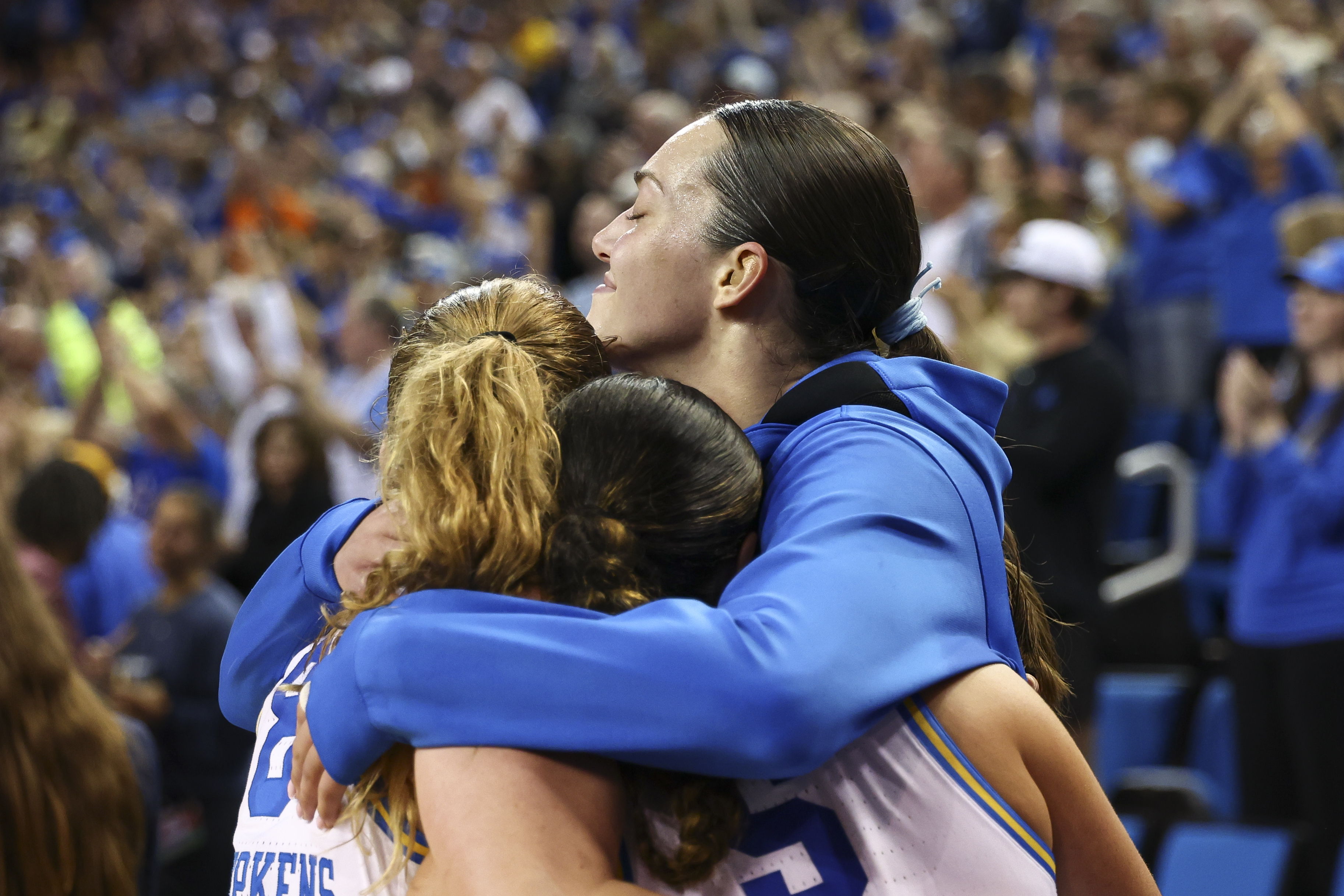 UCLA's Angela Dugalić embraces teammate Gianna Kneepkens